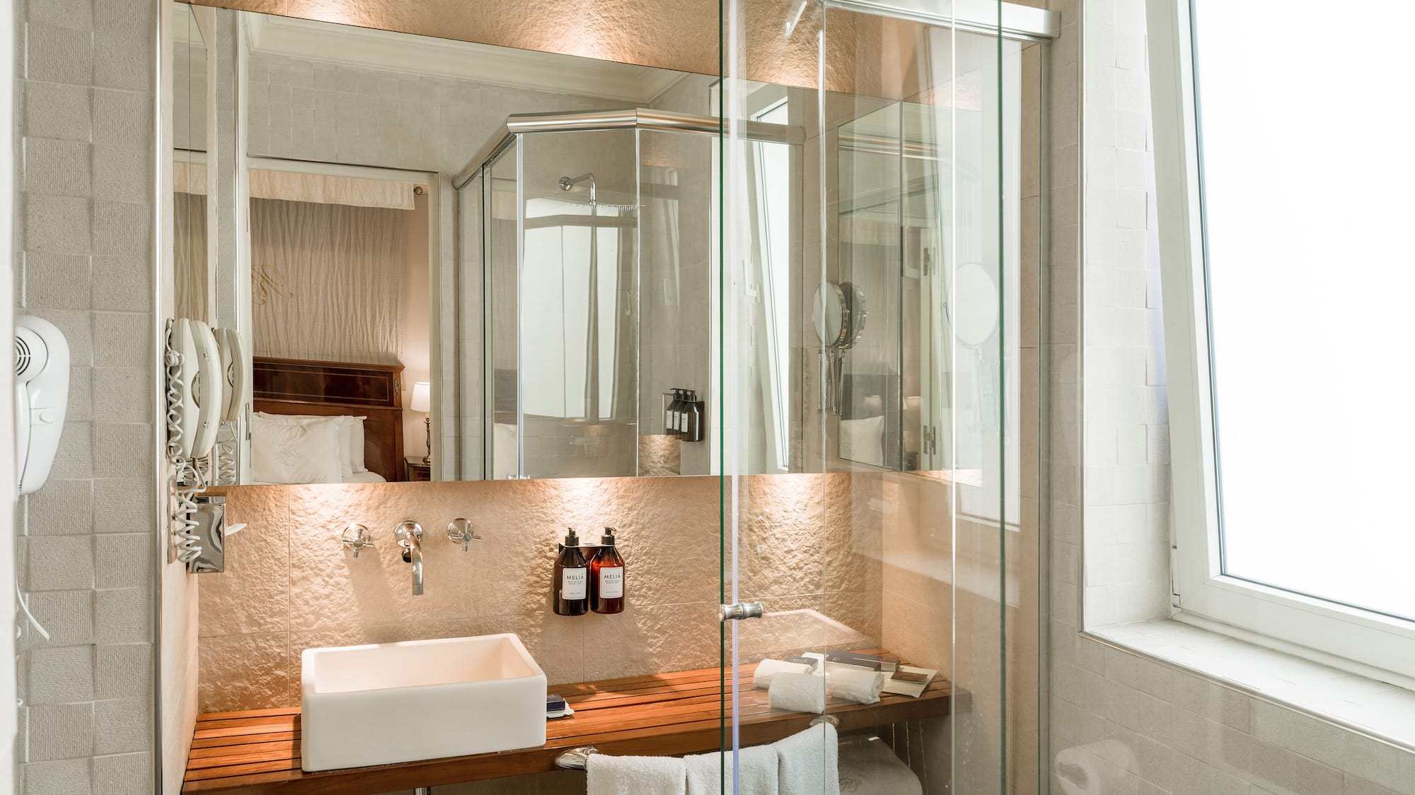 a bathroom with a glass shower door