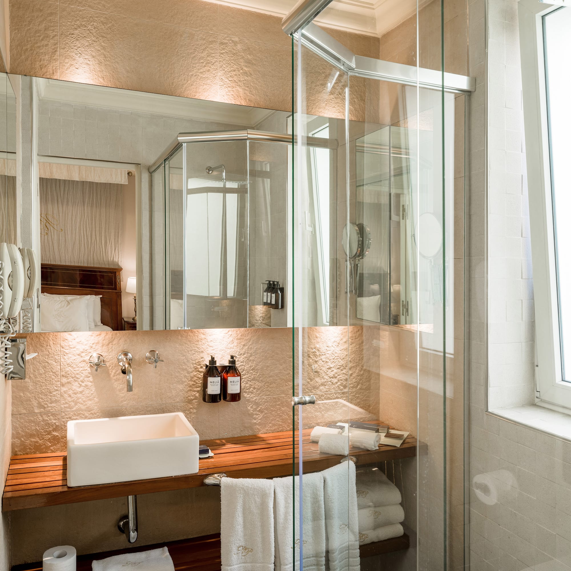 a bathroom with a glass shower door