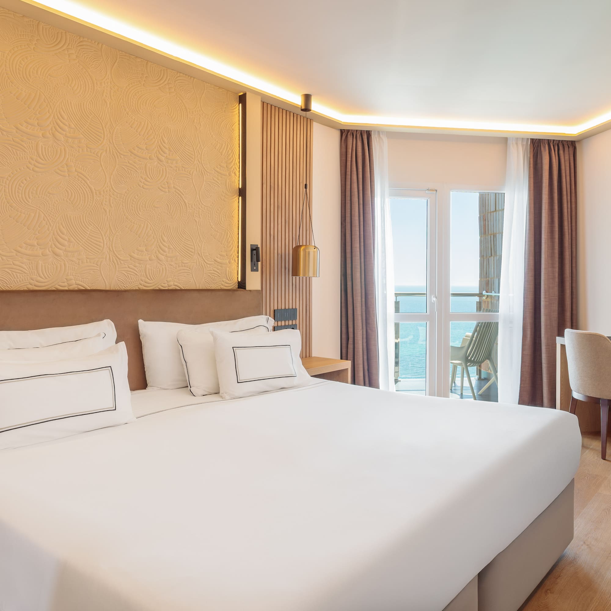 a room with a bed and a chair