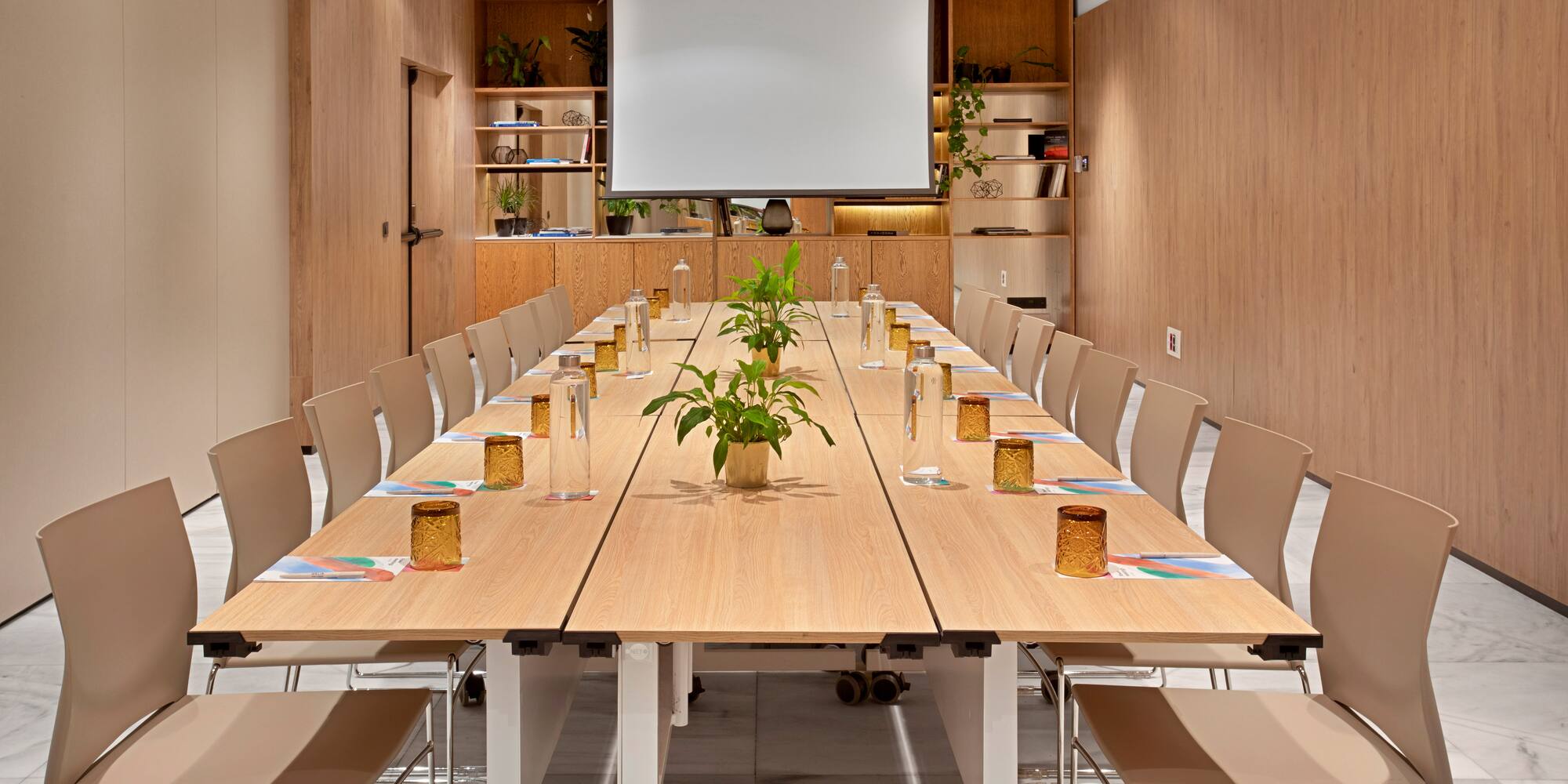 a table with chairs and a plant on it
