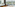a room with a large window overlooking a river