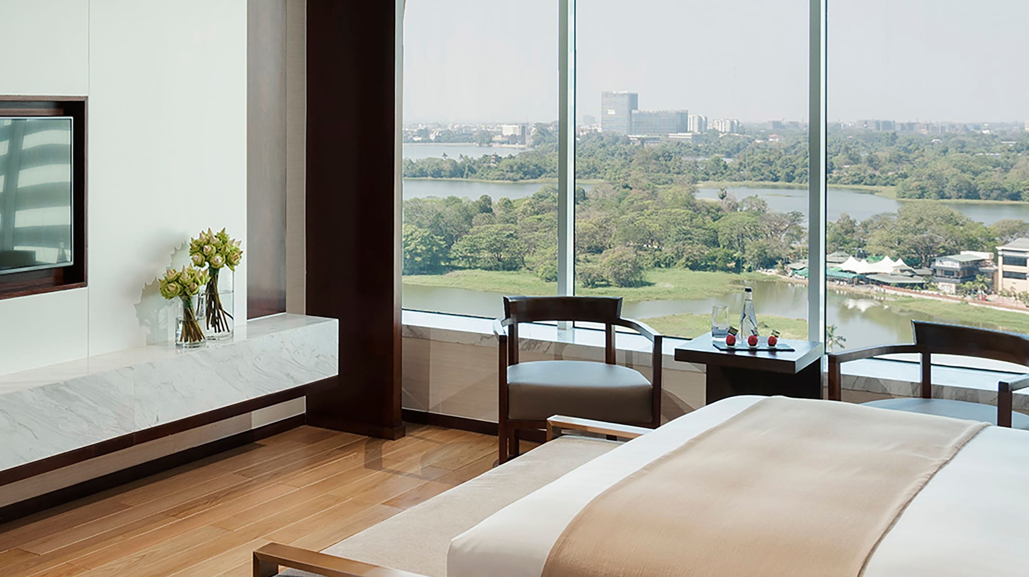 a room with a large window overlooking a river