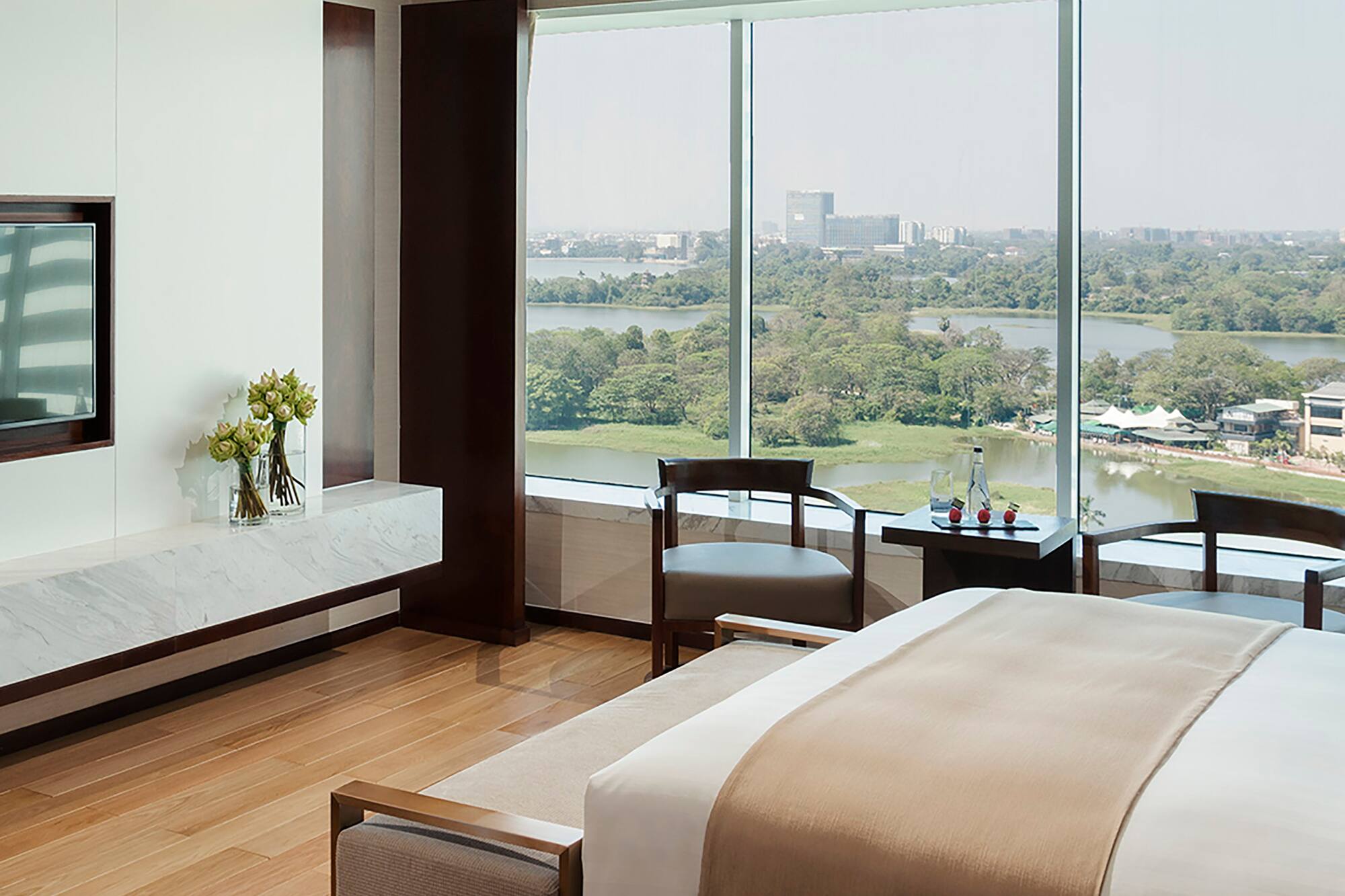 a room with a large window overlooking a river