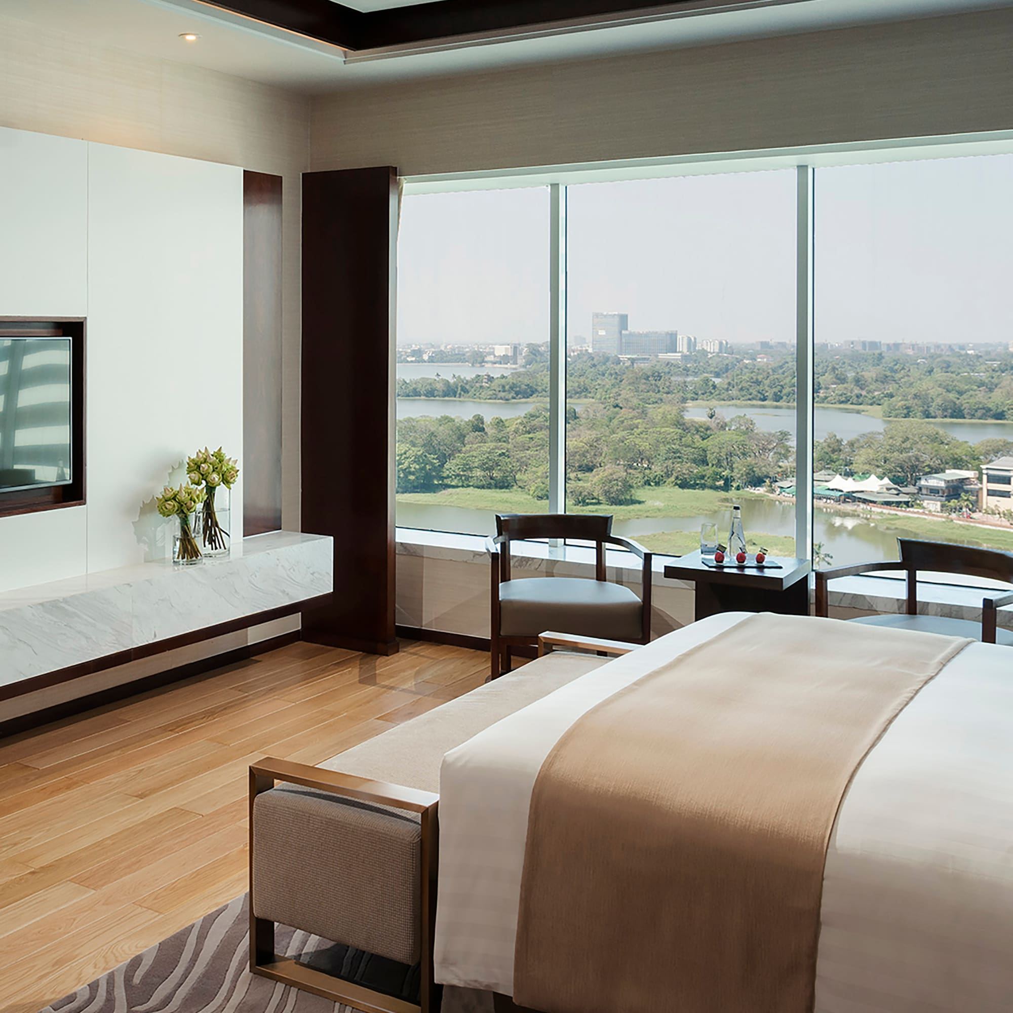 a room with a large window overlooking a river