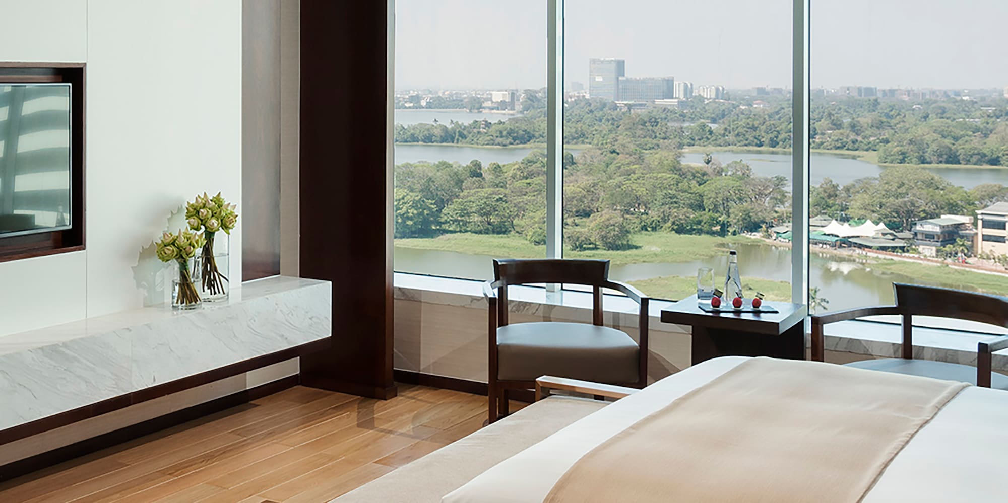 a room with a large window overlooking a river