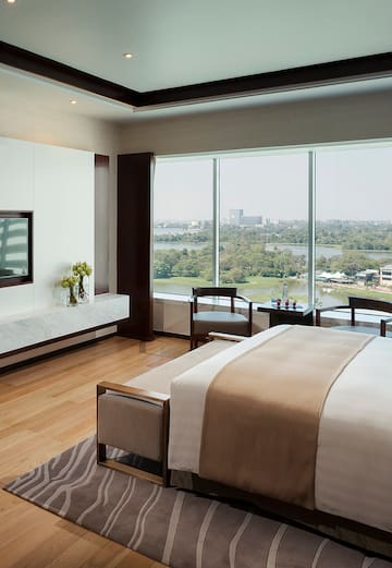 a room with a large window overlooking a river