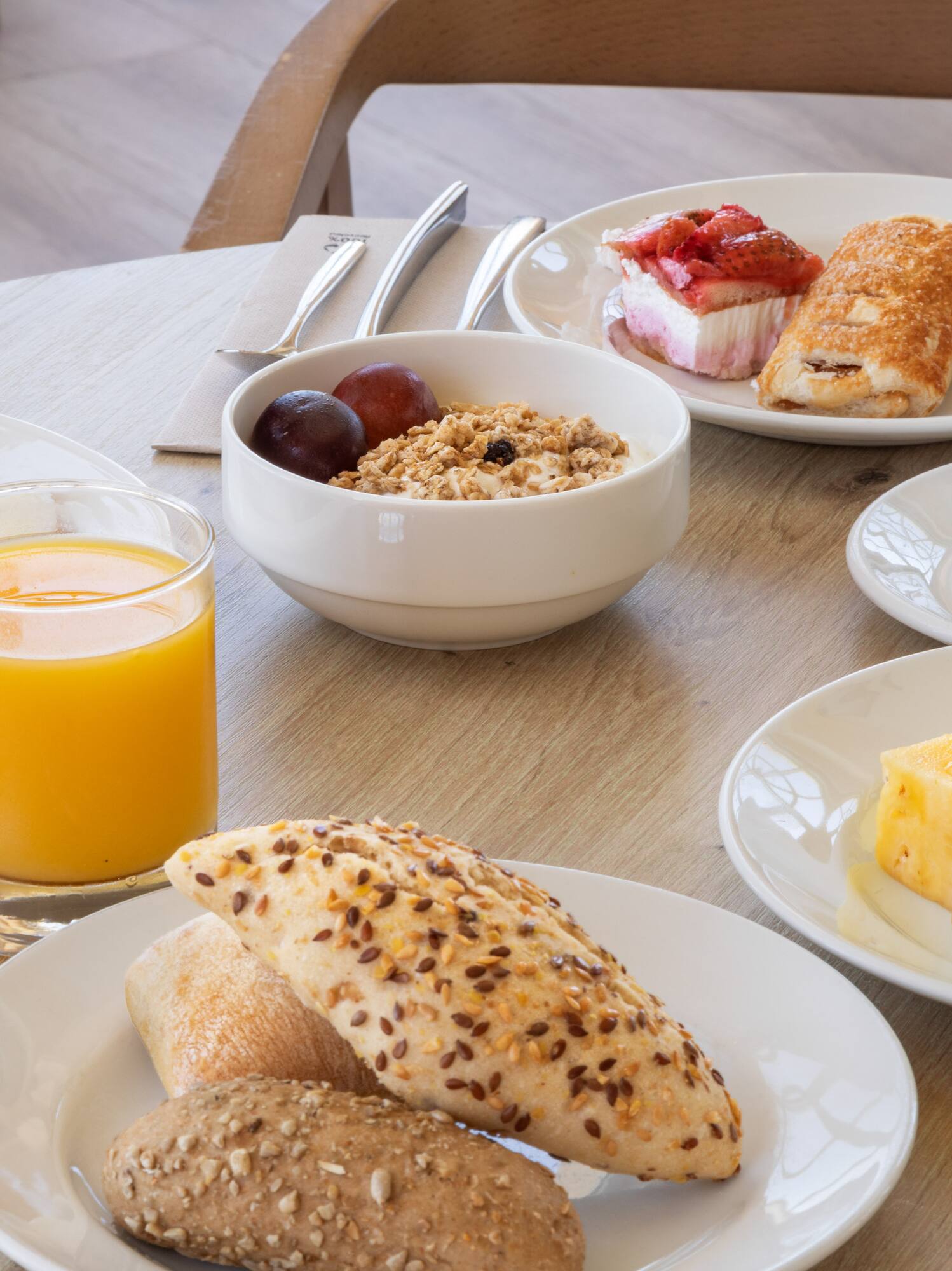 a table with plates of food and drinks