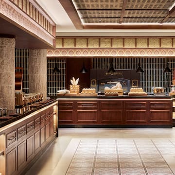 a food court with a counter and a large oven