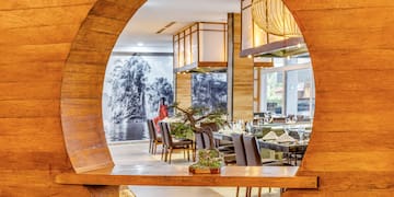 a circular object with a bonsai tree in it