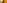 Bright orange turmeric spice powder in metal bowl.