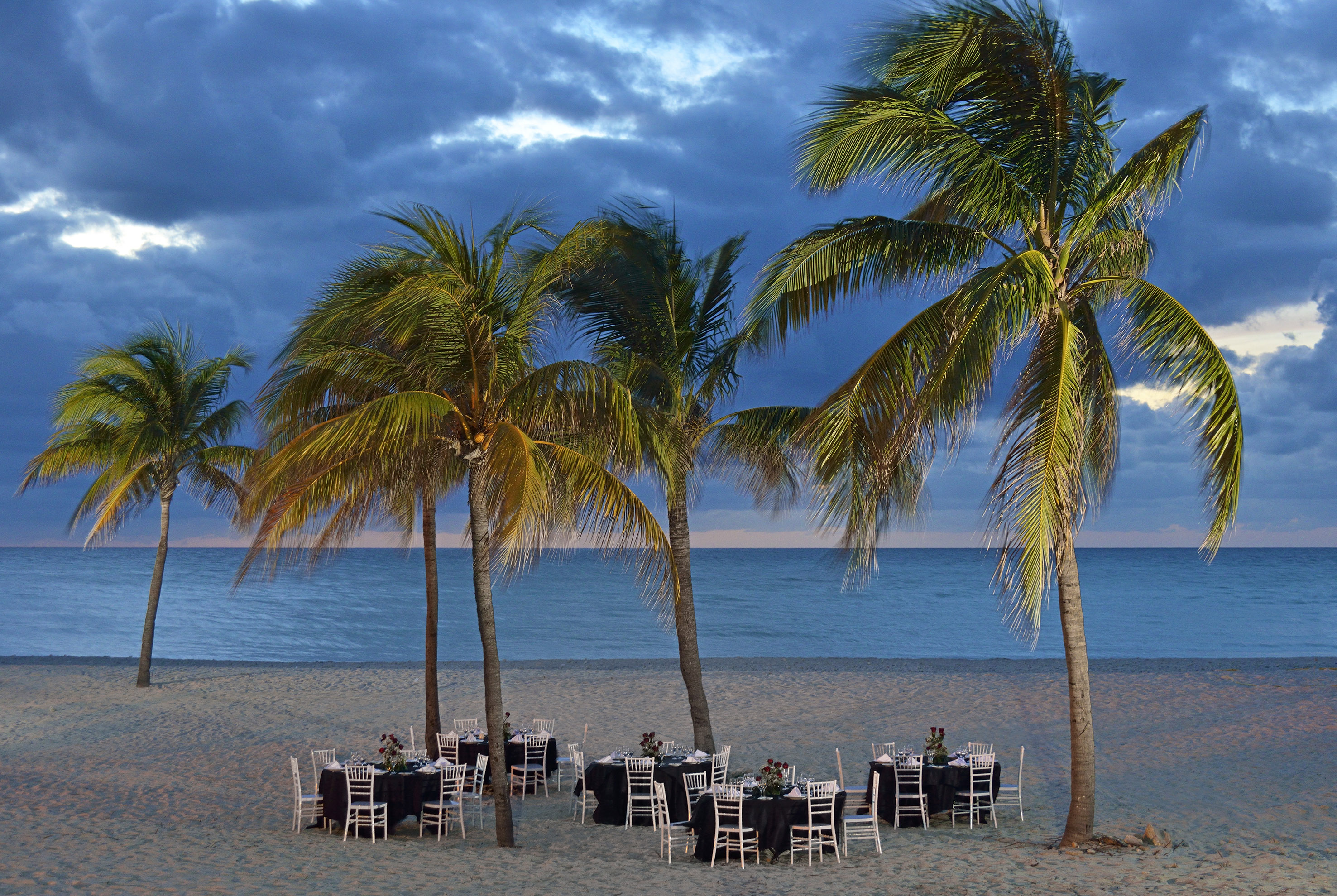 a group of tables on a beach