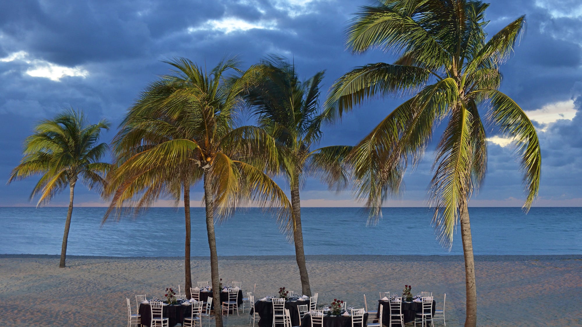 a group of tables on a beach
