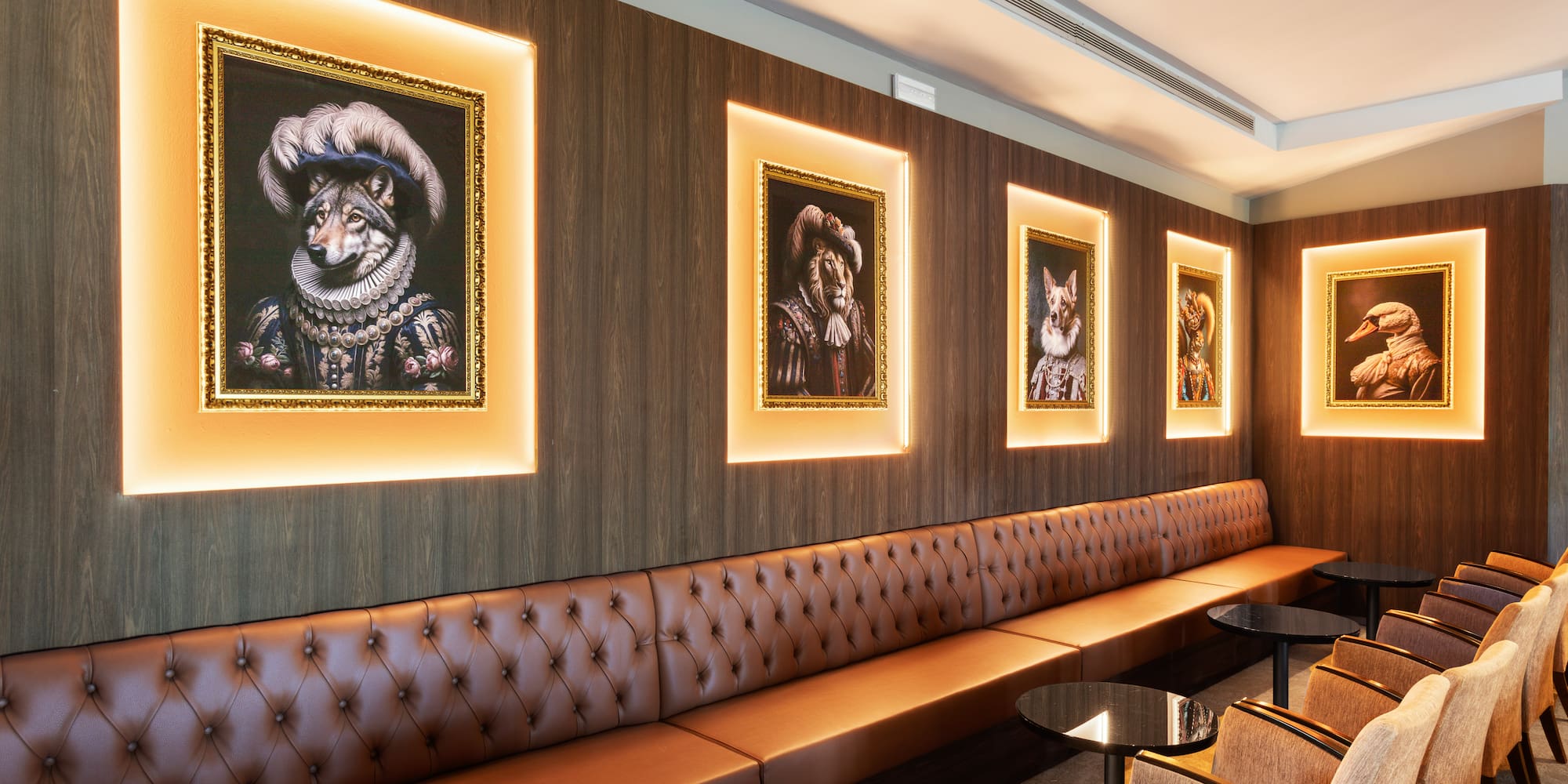 a room with a booth and a table and chairs