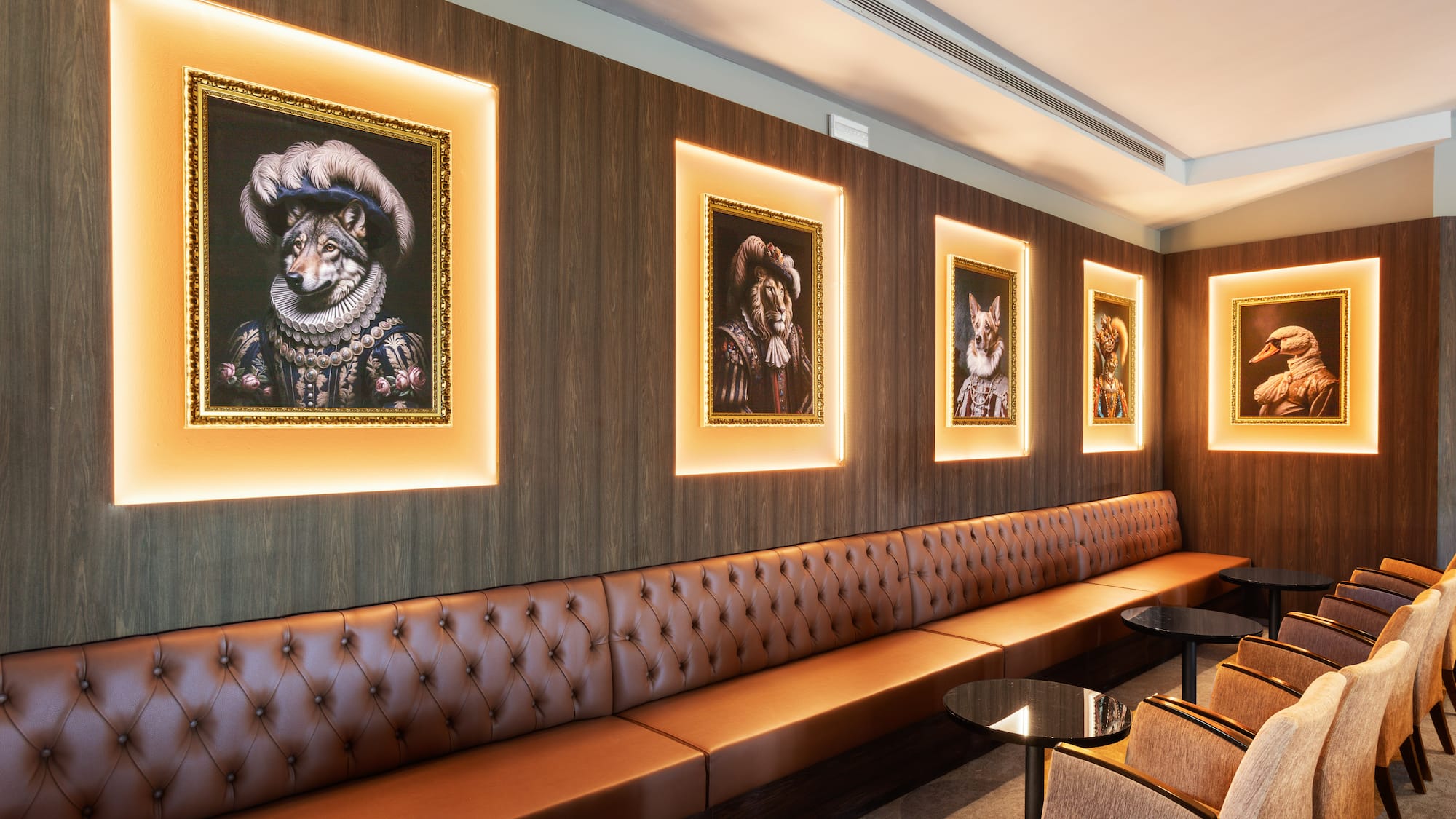 a room with a booth and a table and chairs