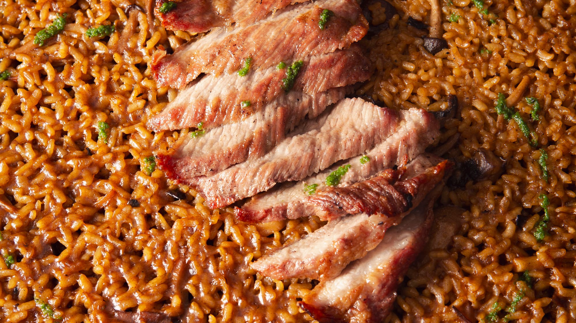 a plate of food with meat and rice