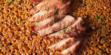 a plate of food with meat and rice