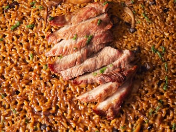 a plate of food with meat and rice