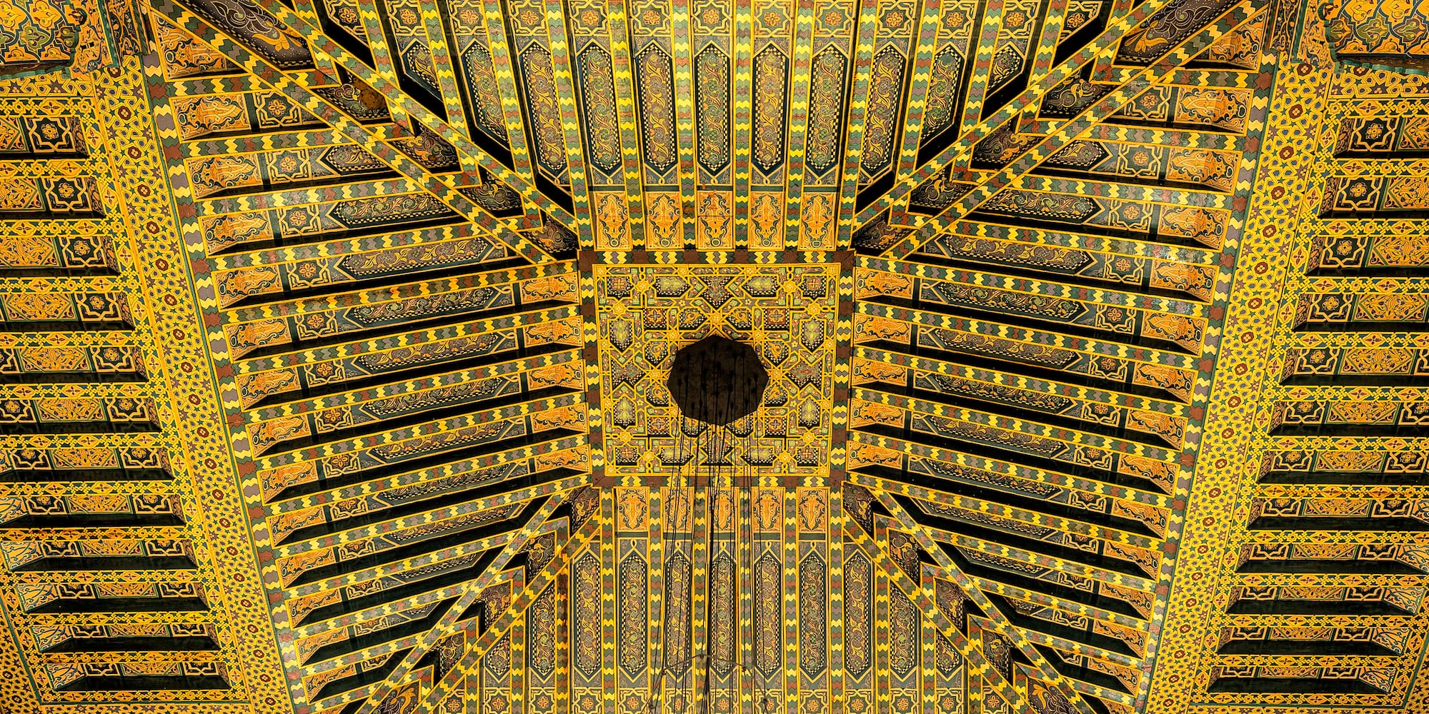 a yellow and orange patterned ceiling