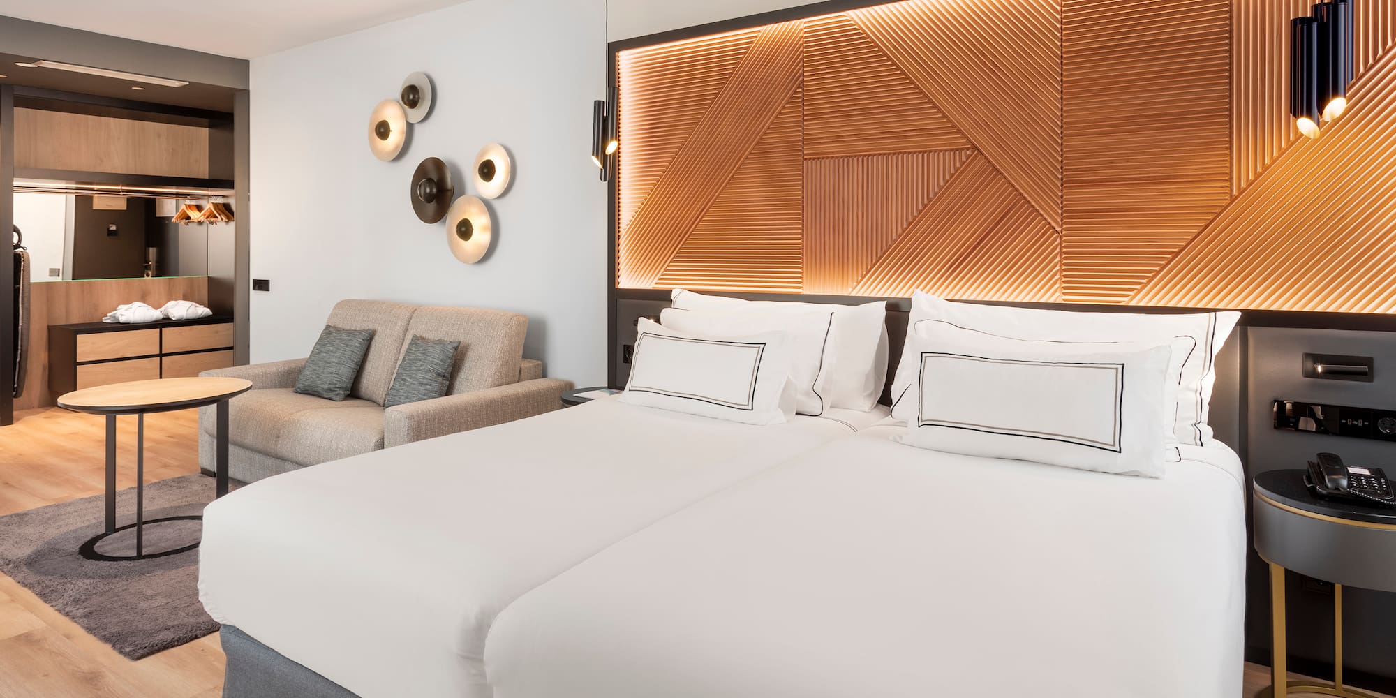 a room with two beds and a couch