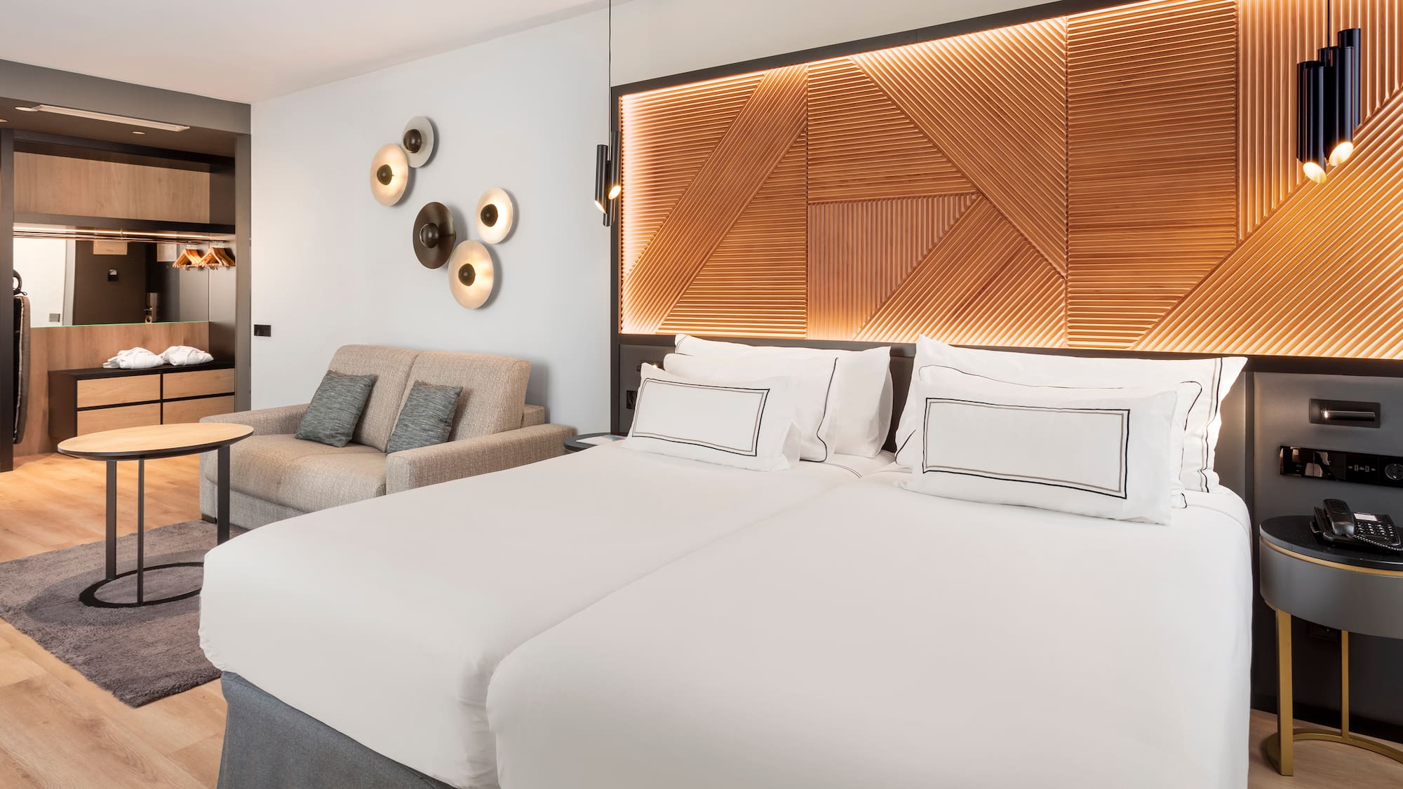 a room with two beds and a couch