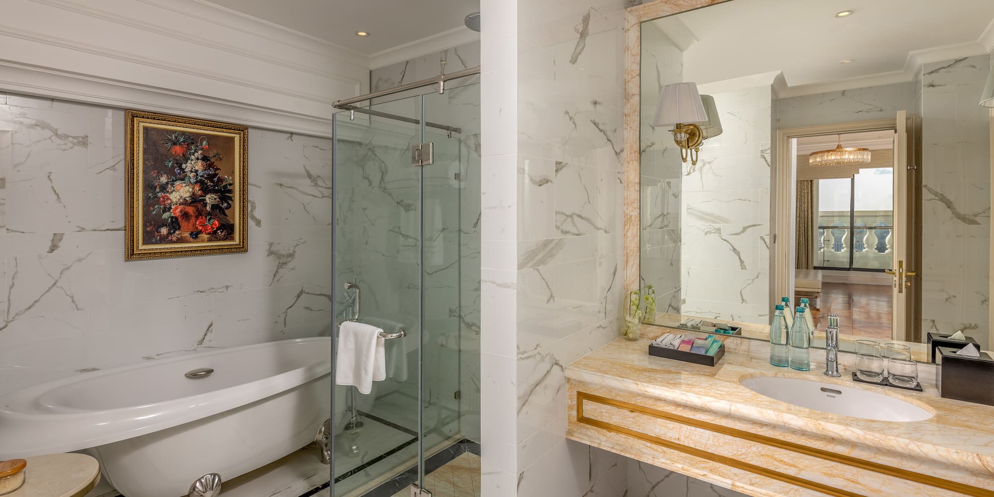 a bathroom with a glass shower and sink