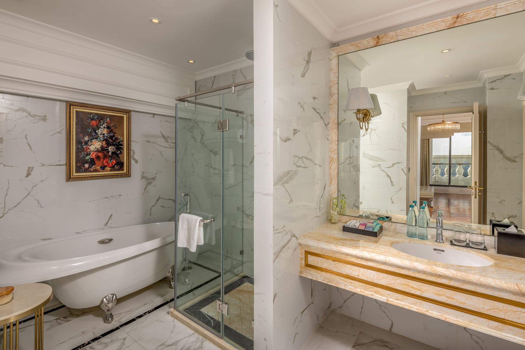 a bathroom with a glass shower and sink