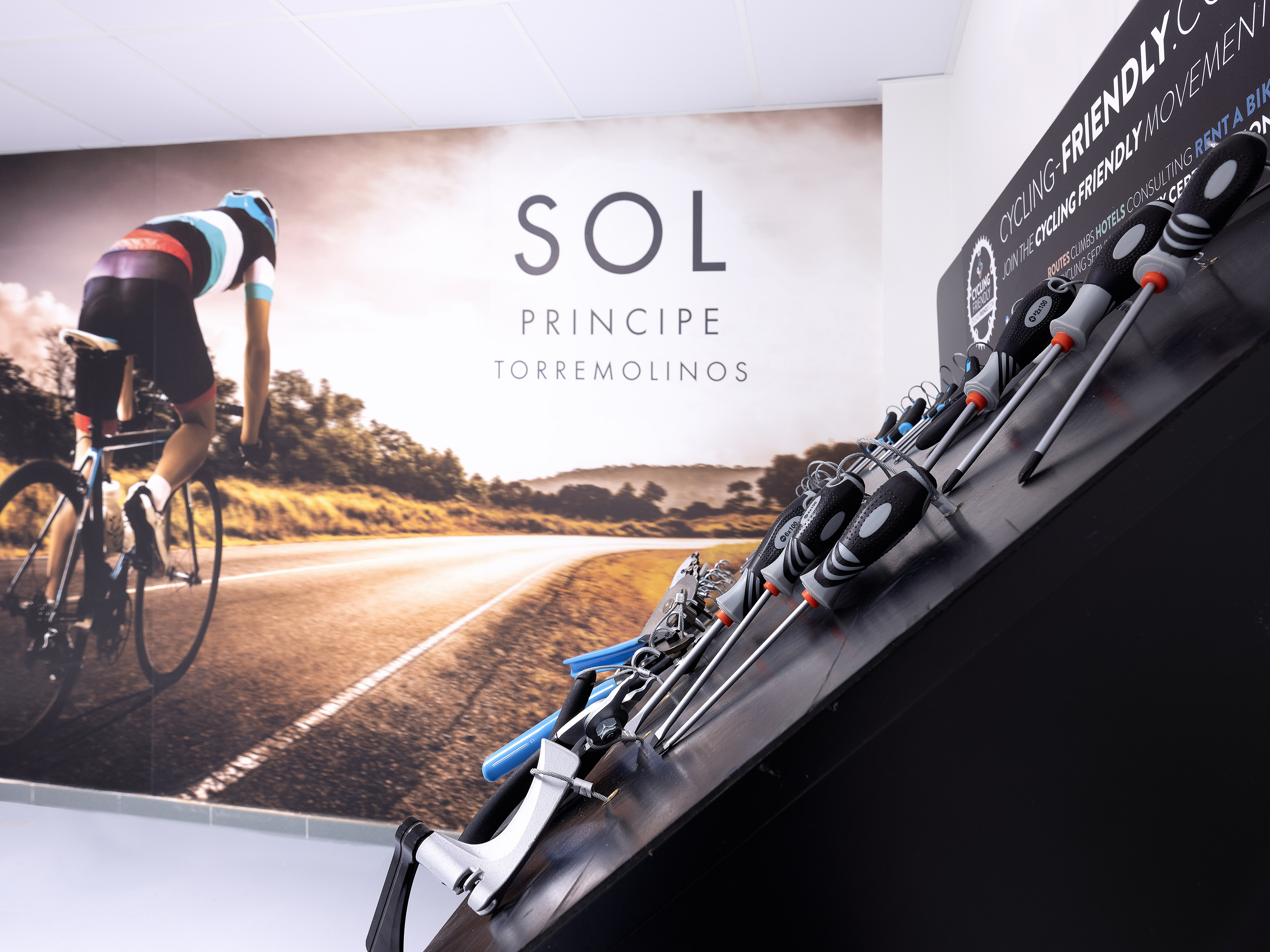 Sol Principe Torremolinos cycling hotel offering bike tools and cyclist mural.