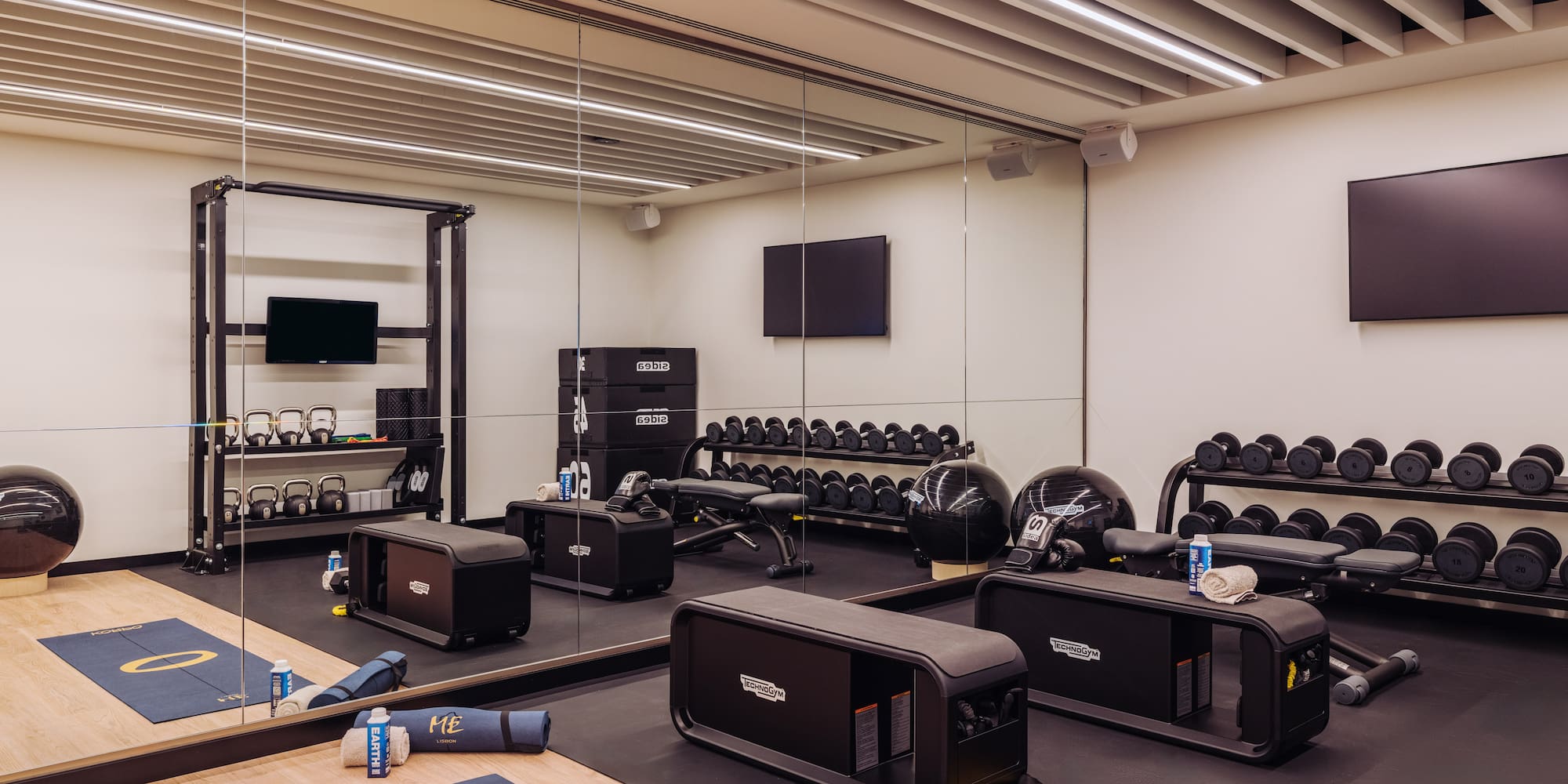 a gym with weights and equipment