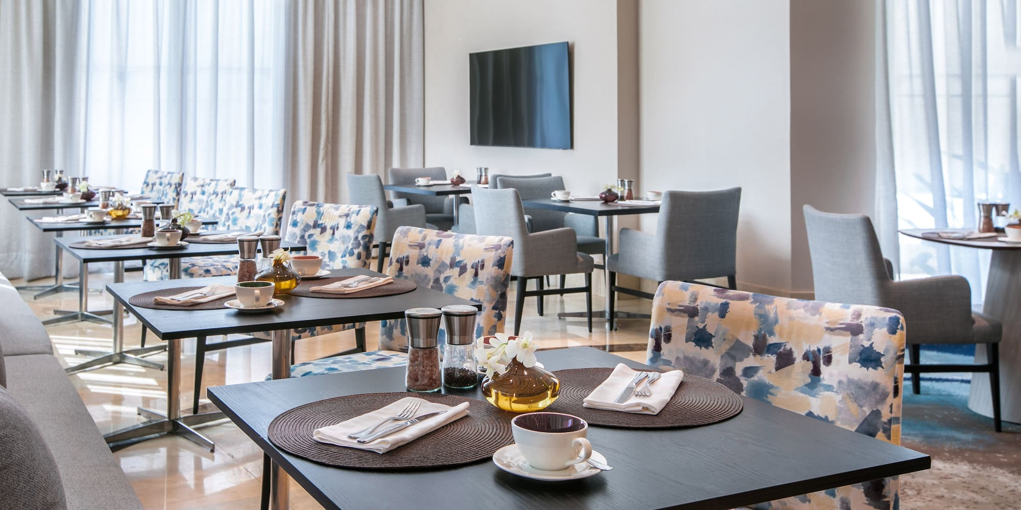 a room with a large table and couches