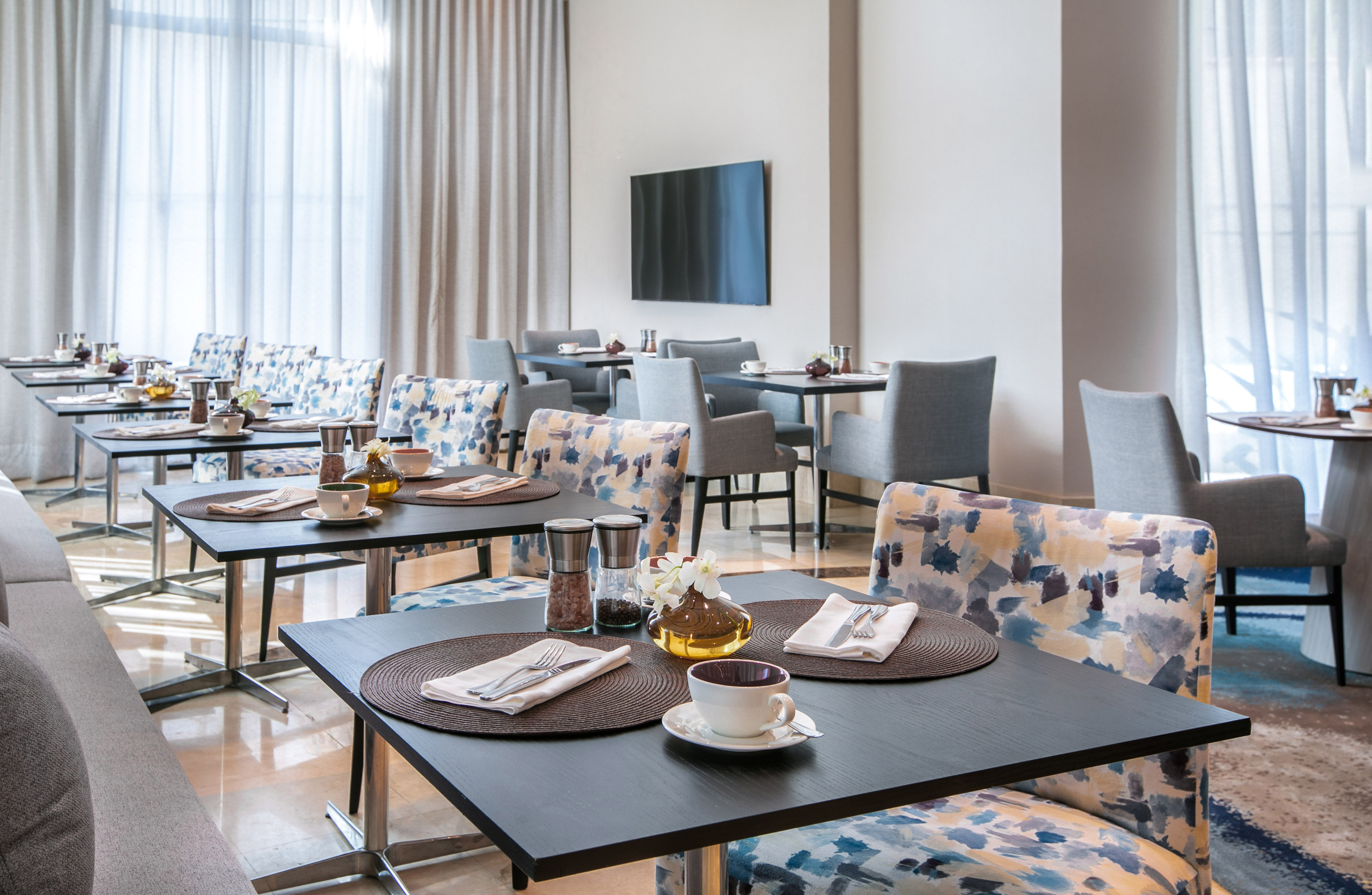 a room with a large table and couches