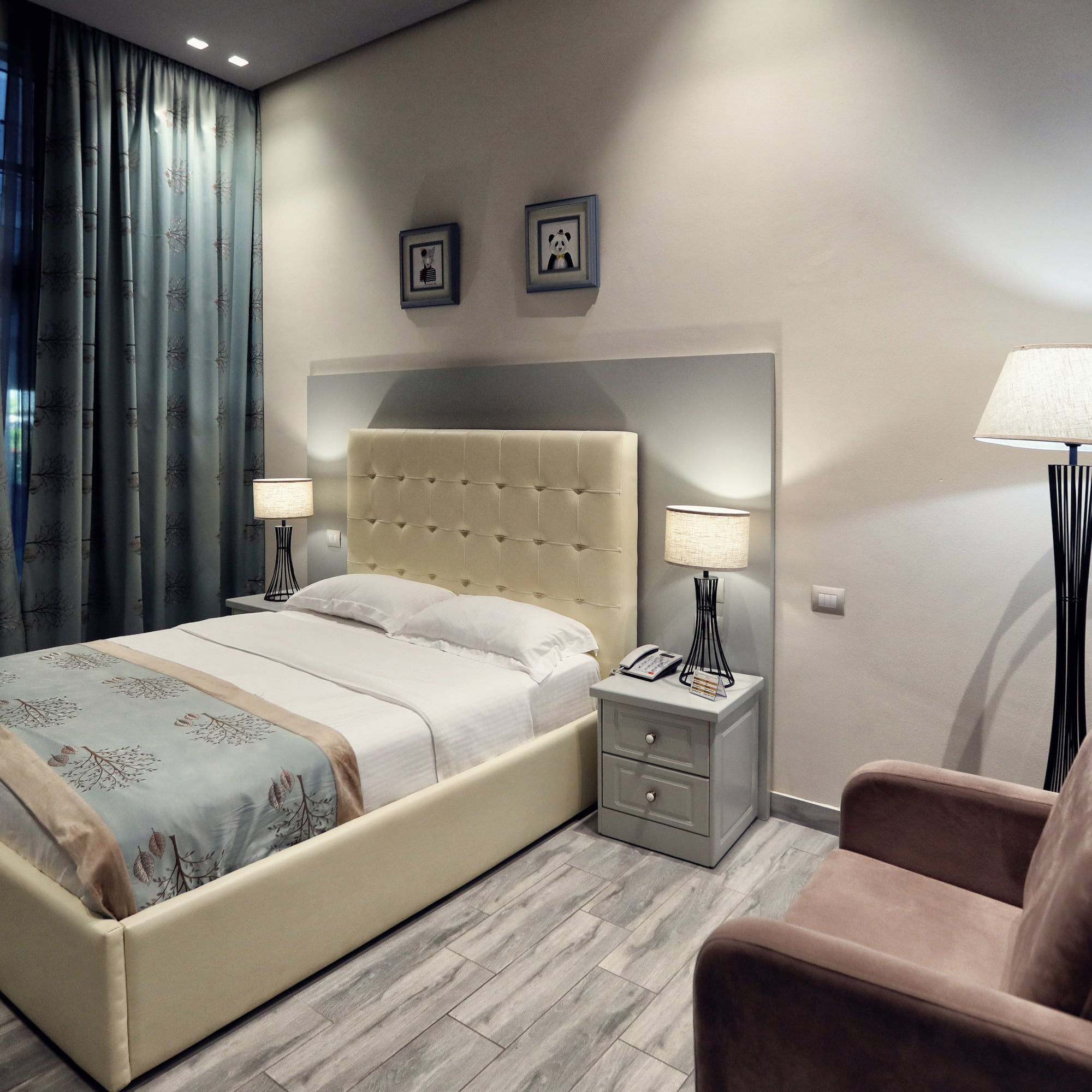 a bedroom with a bed and a chair