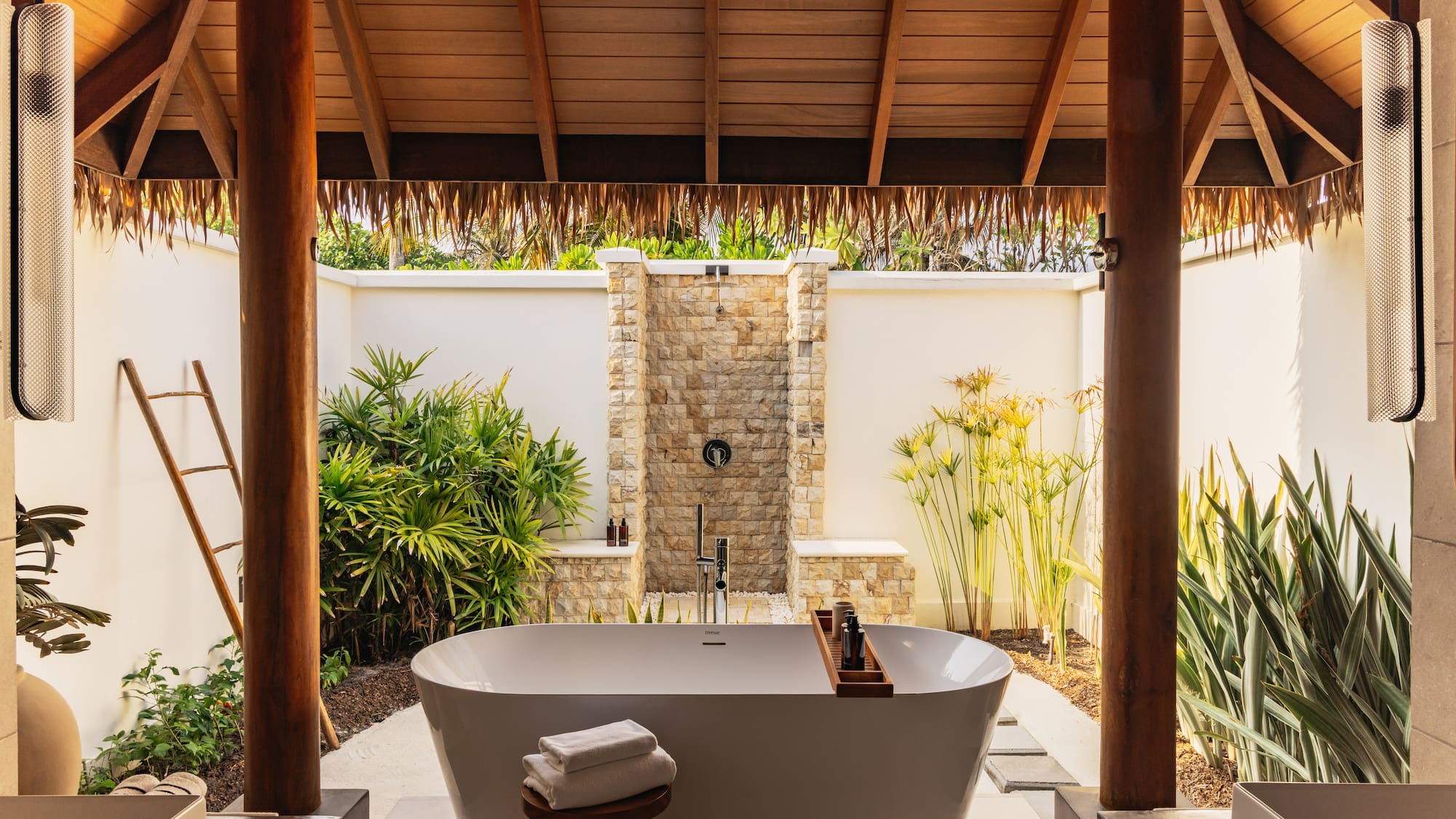 a bathtub outside of a house