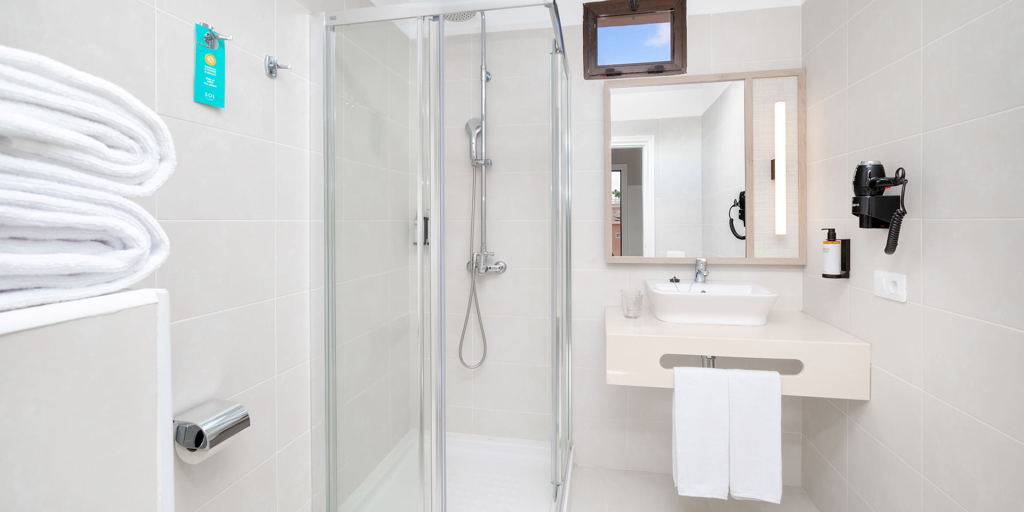 a bathroom with a shower and sink