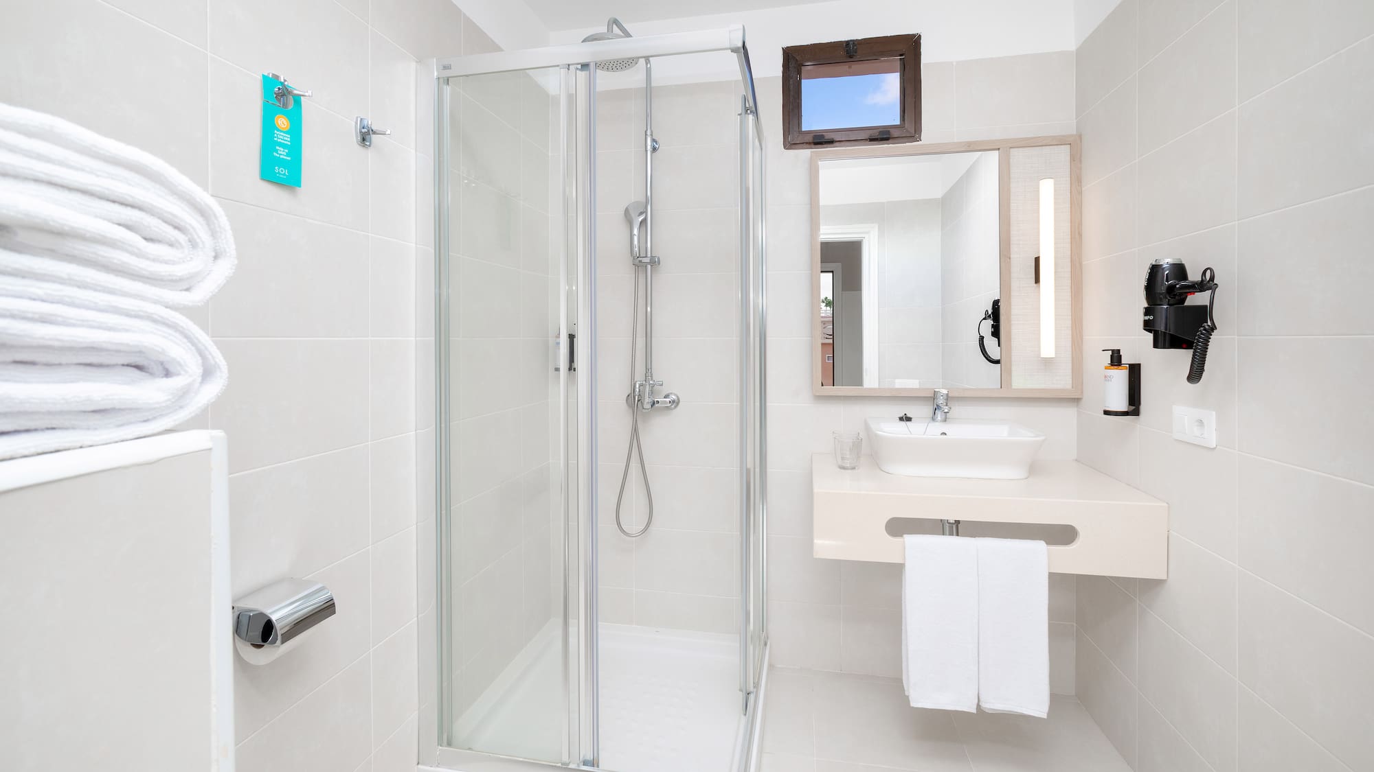 a bathroom with a shower and sink