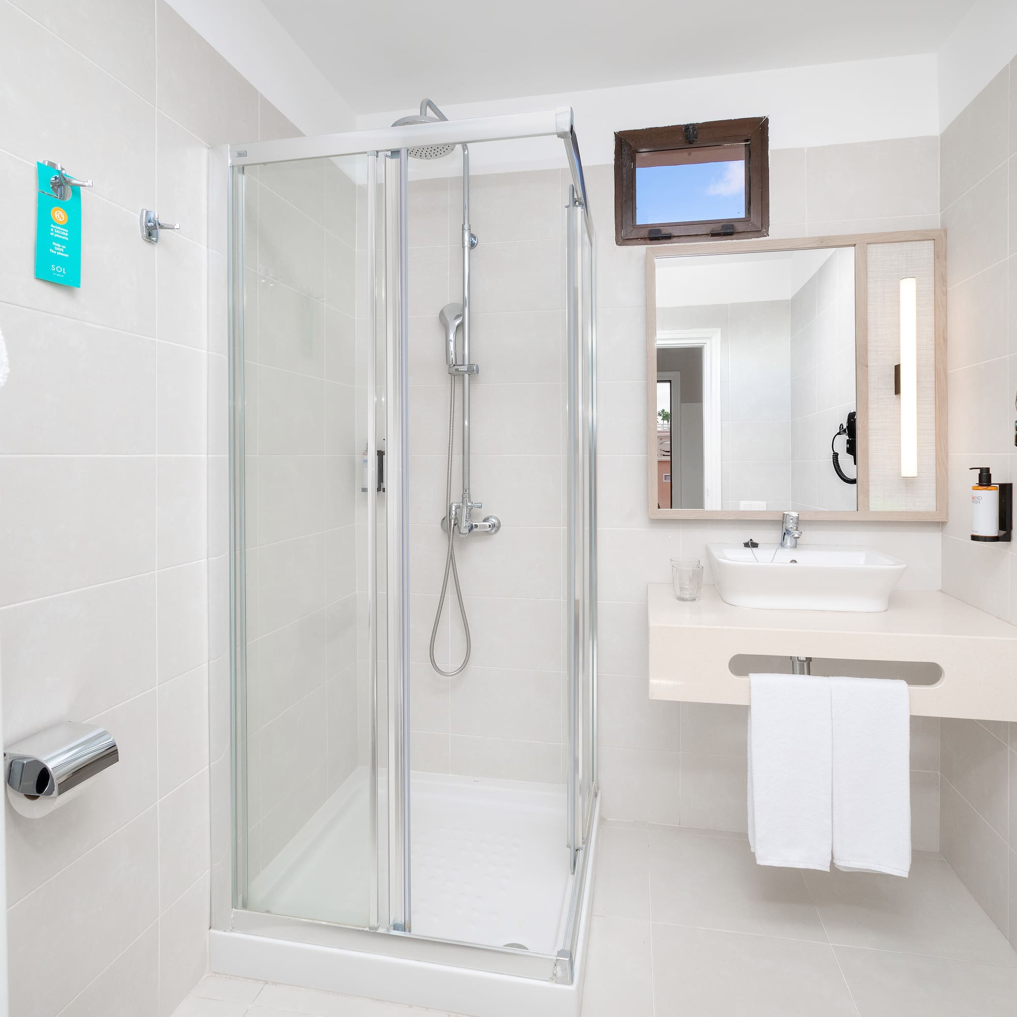 a bathroom with a shower and sink