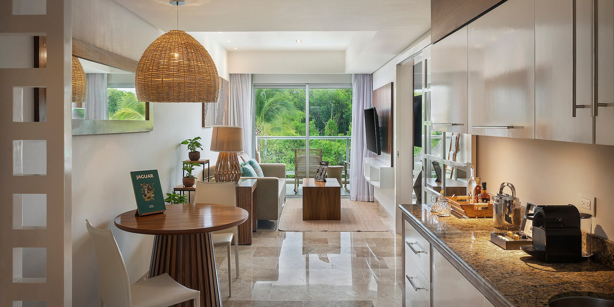 a room with a table and chairs and a television