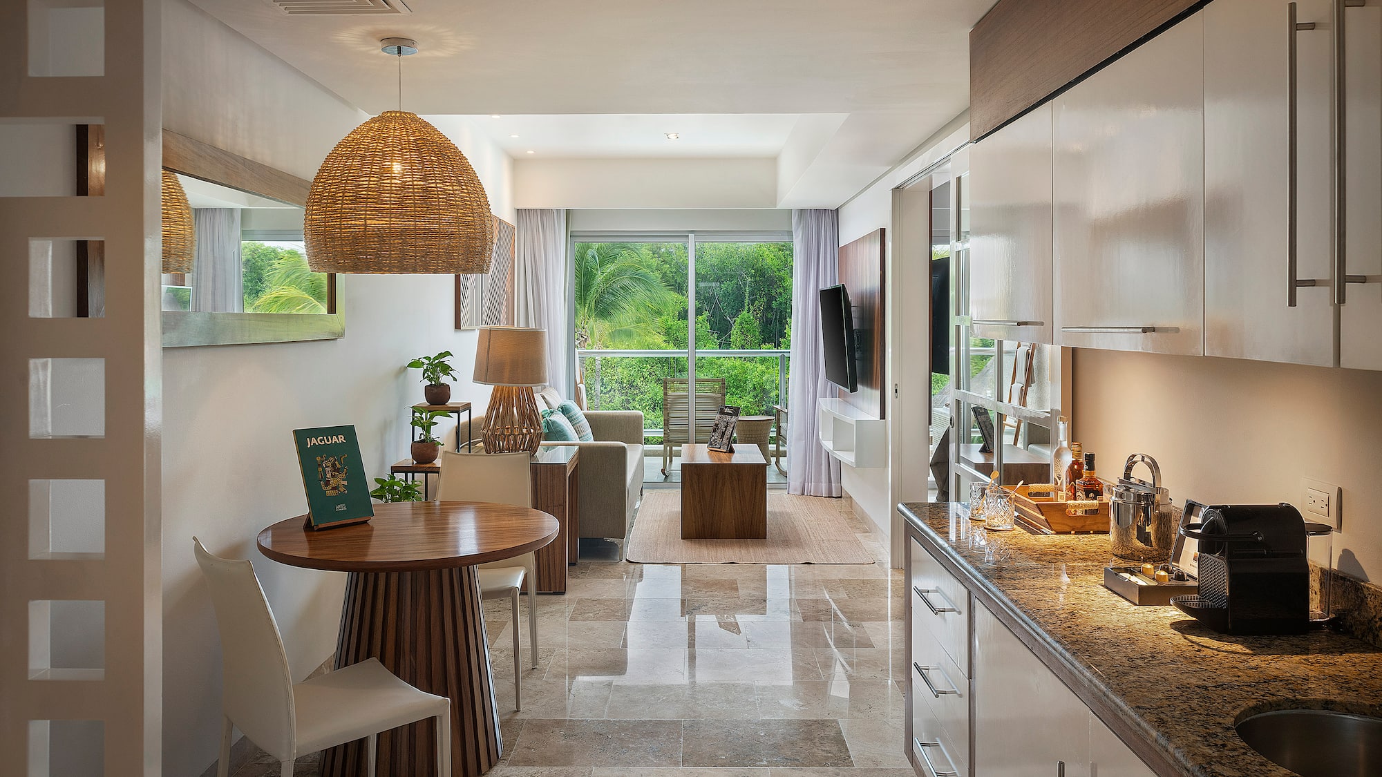 a room with a table and chairs and a television