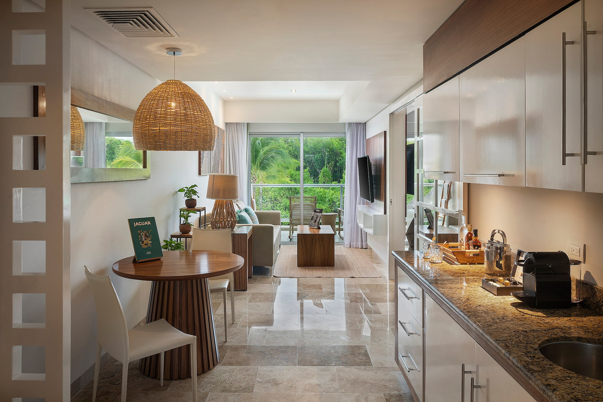 a room with a table and chairs and a television
