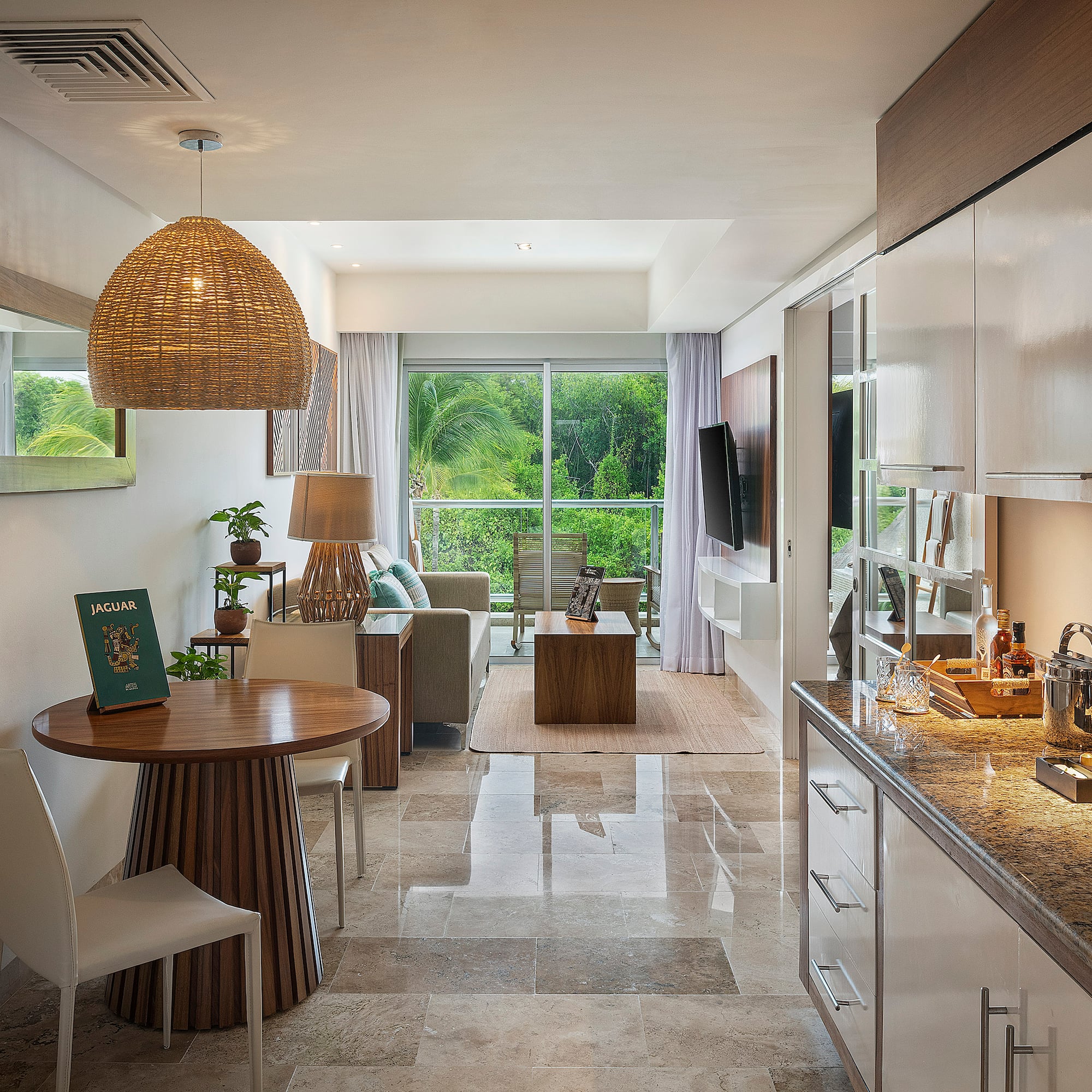 a room with a table and chairs and a television