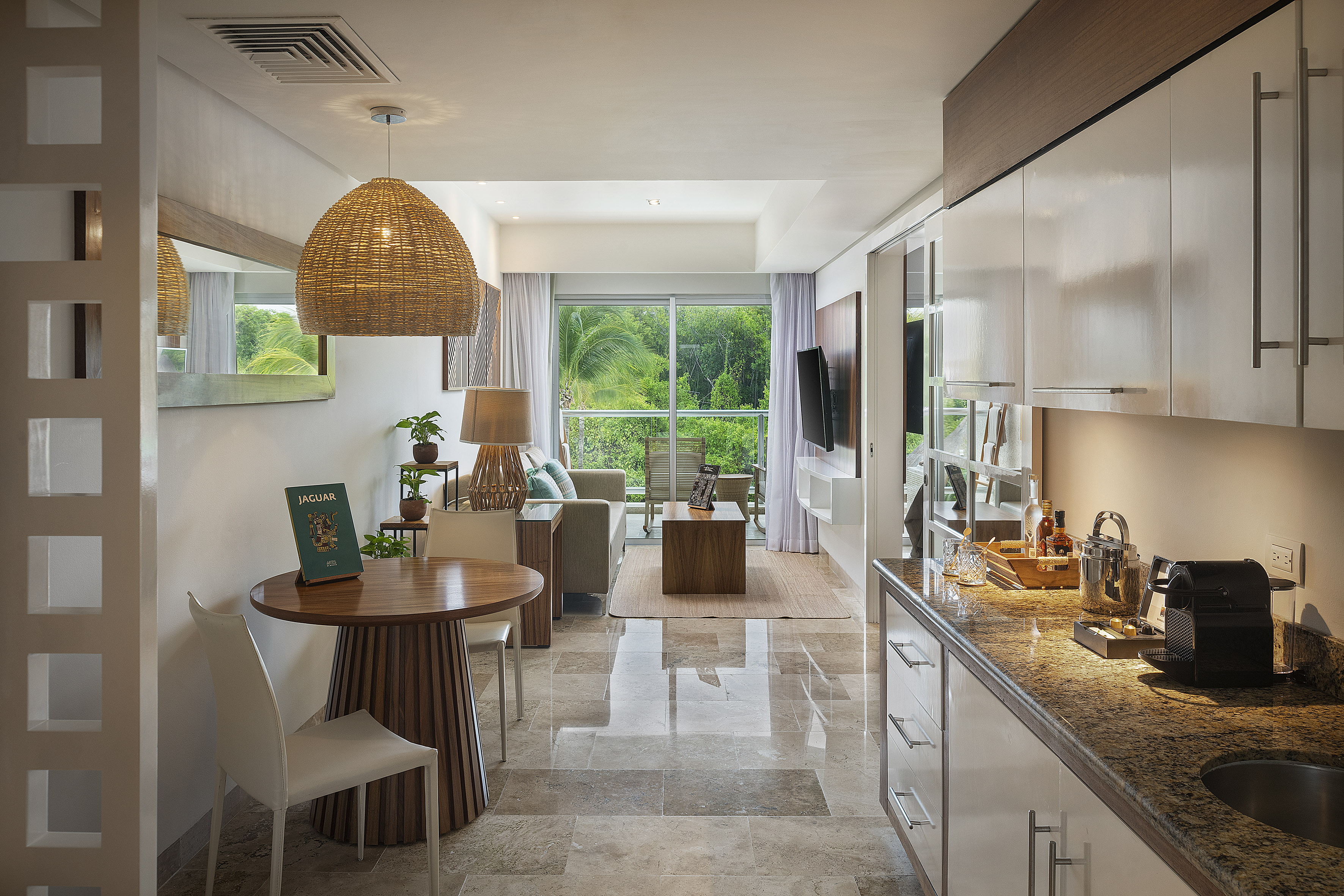 a room with a table and chairs and a television