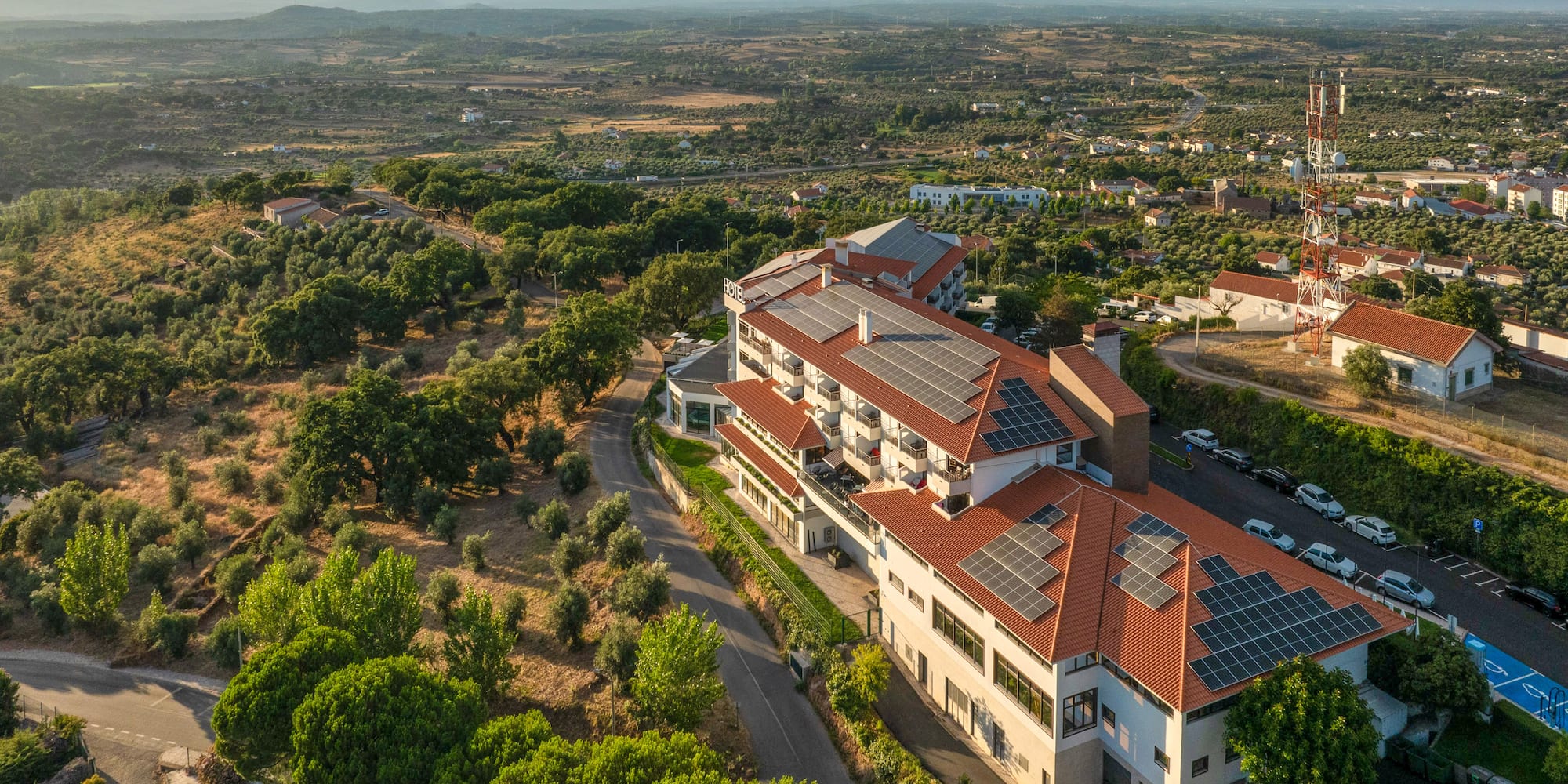 a building with solar panels on the roof
