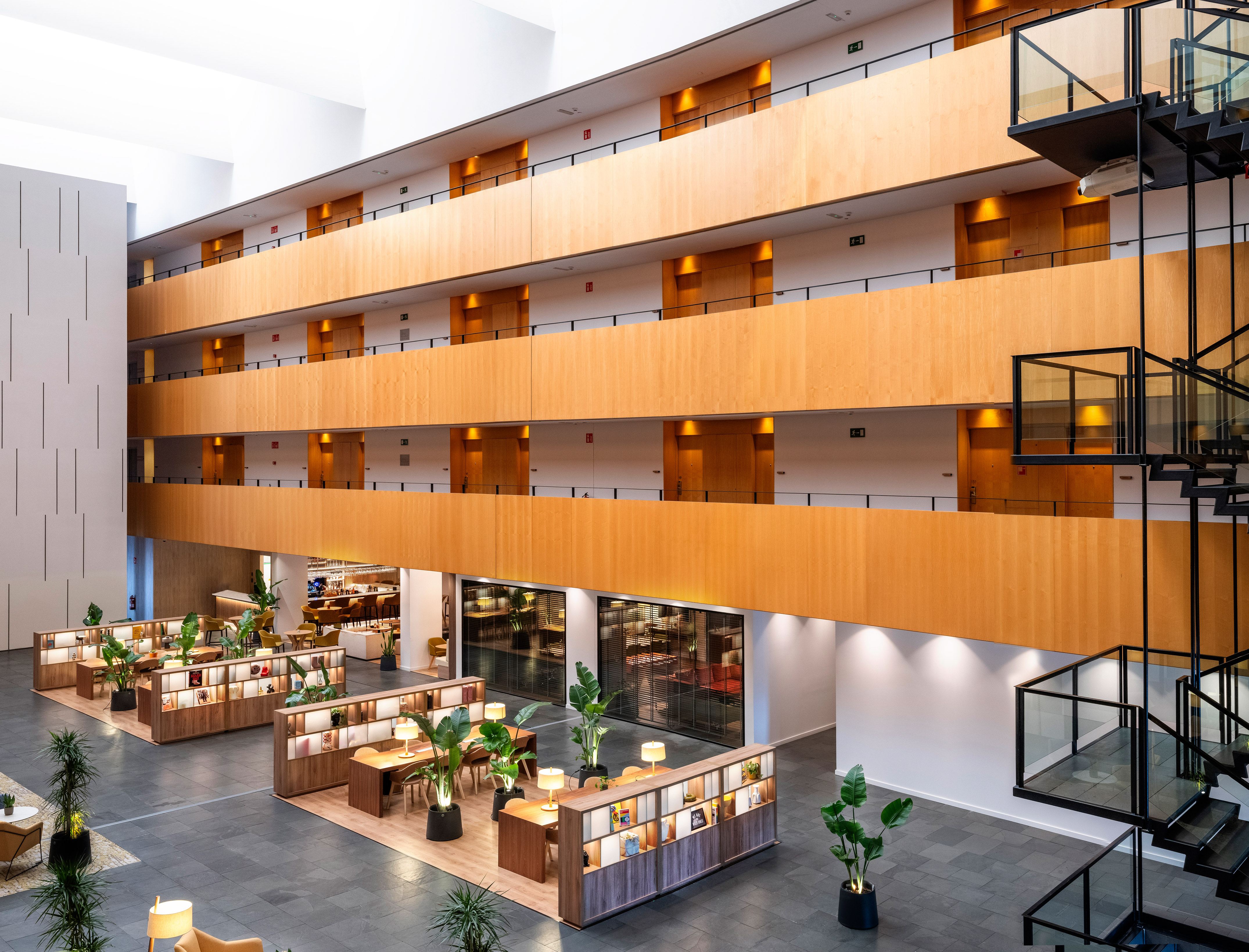 a large building with a large balcony and tables