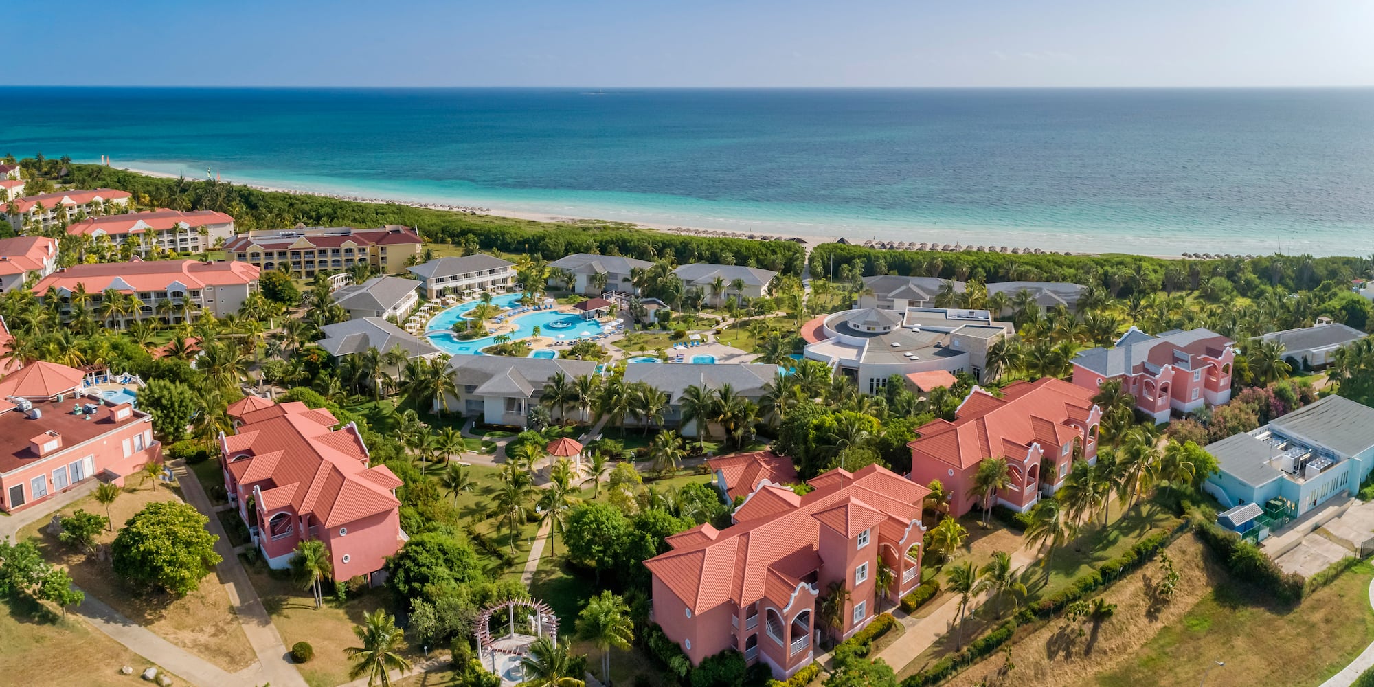 a group of buildings next to a body of water