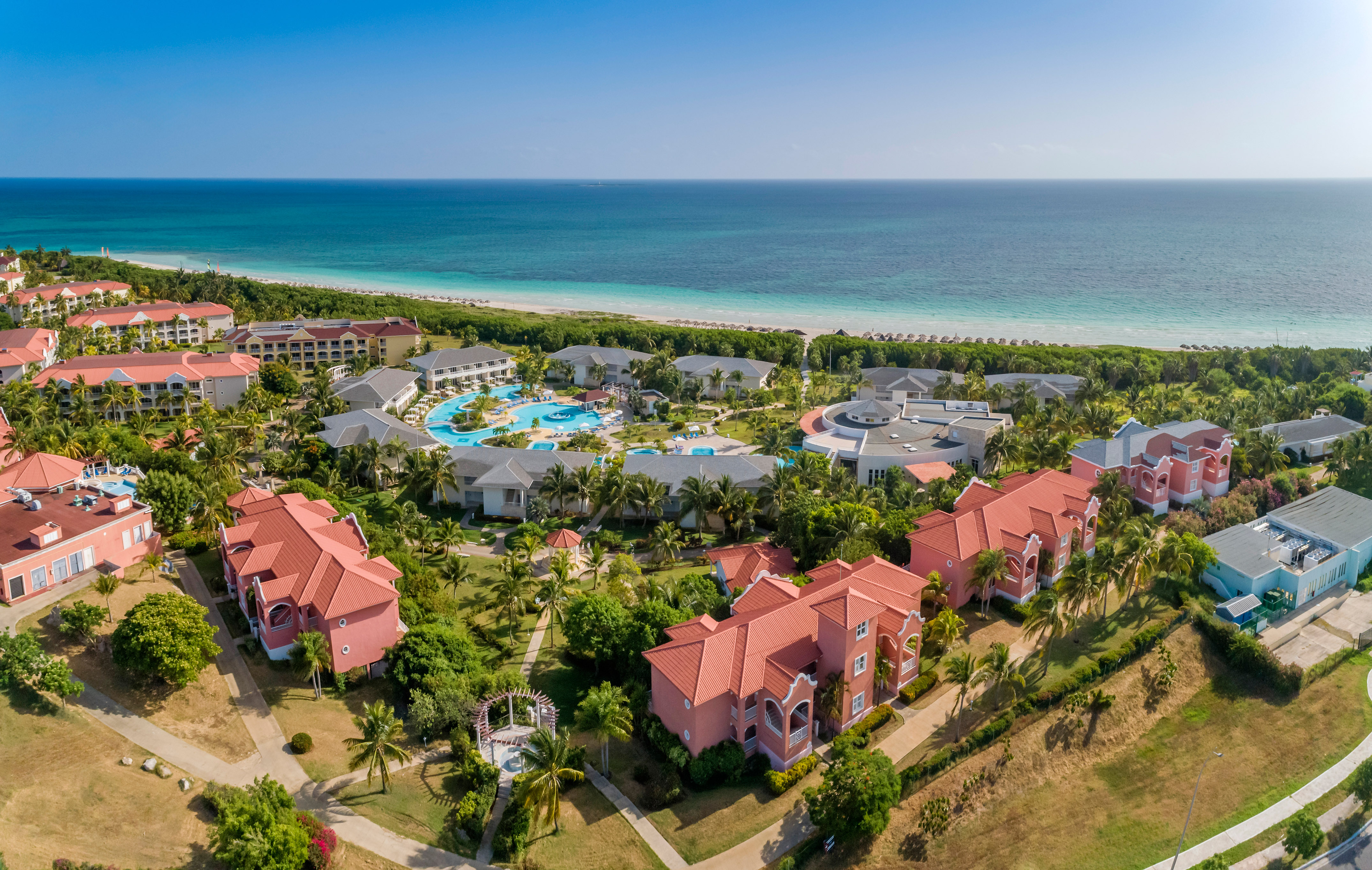 a group of buildings next to a body of water