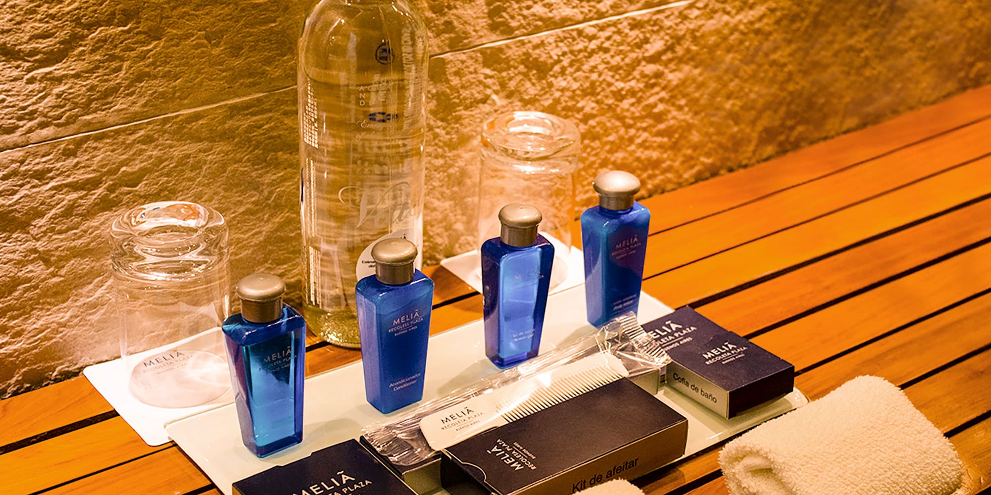a group of bottles and towels on a table