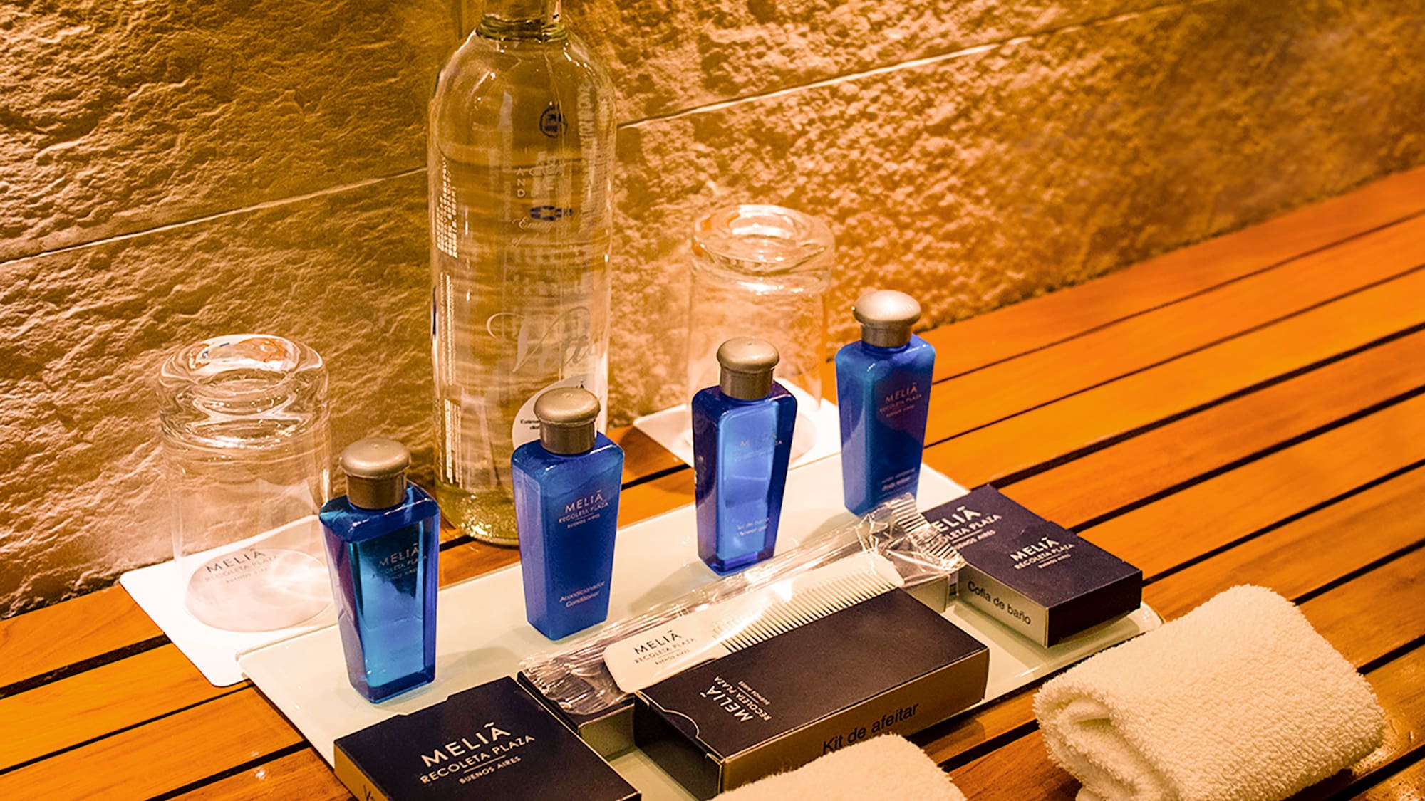 a group of bottles and towels on a table