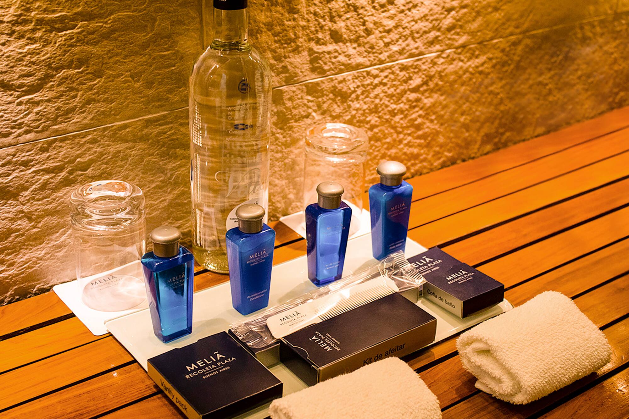 a group of bottles and towels on a table