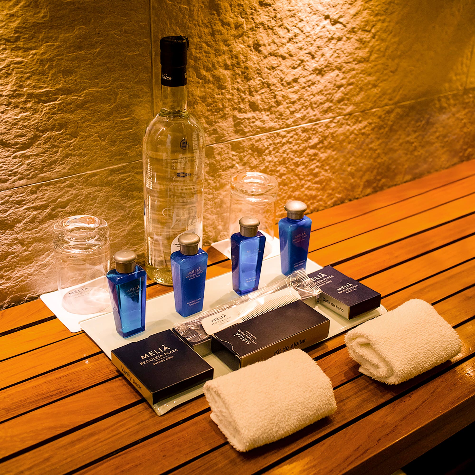 a group of bottles and towels on a table