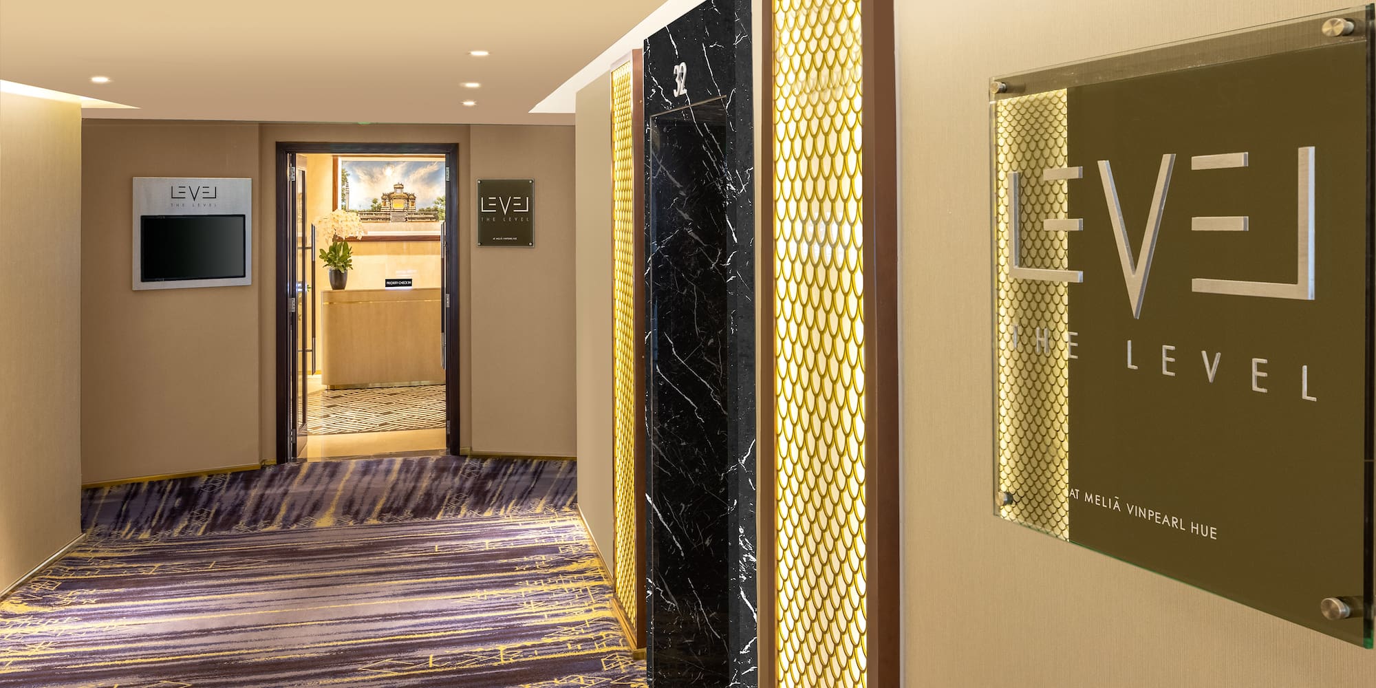 a hallway with a sign on the wall