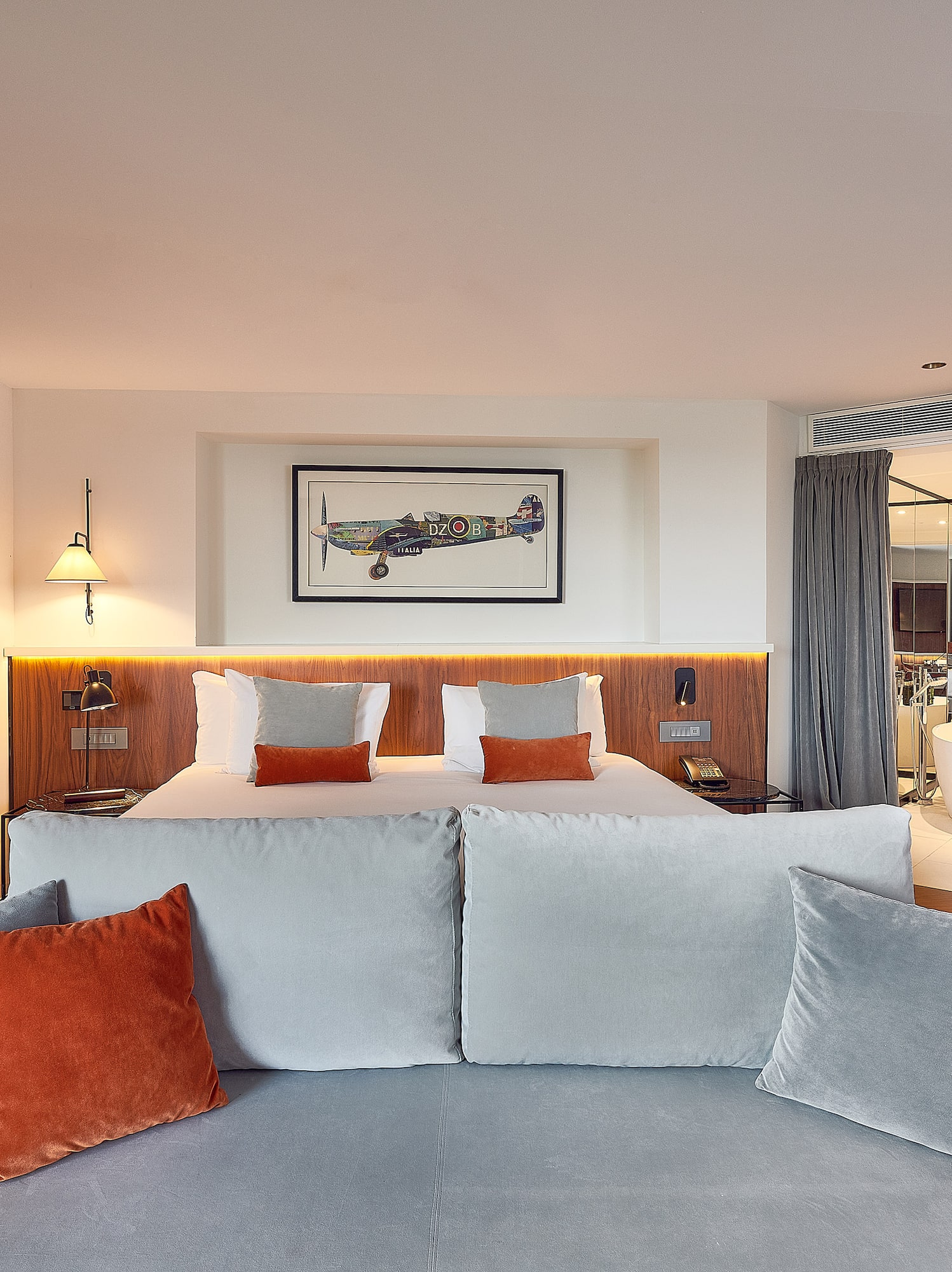 a room with a bed and a bathtub
